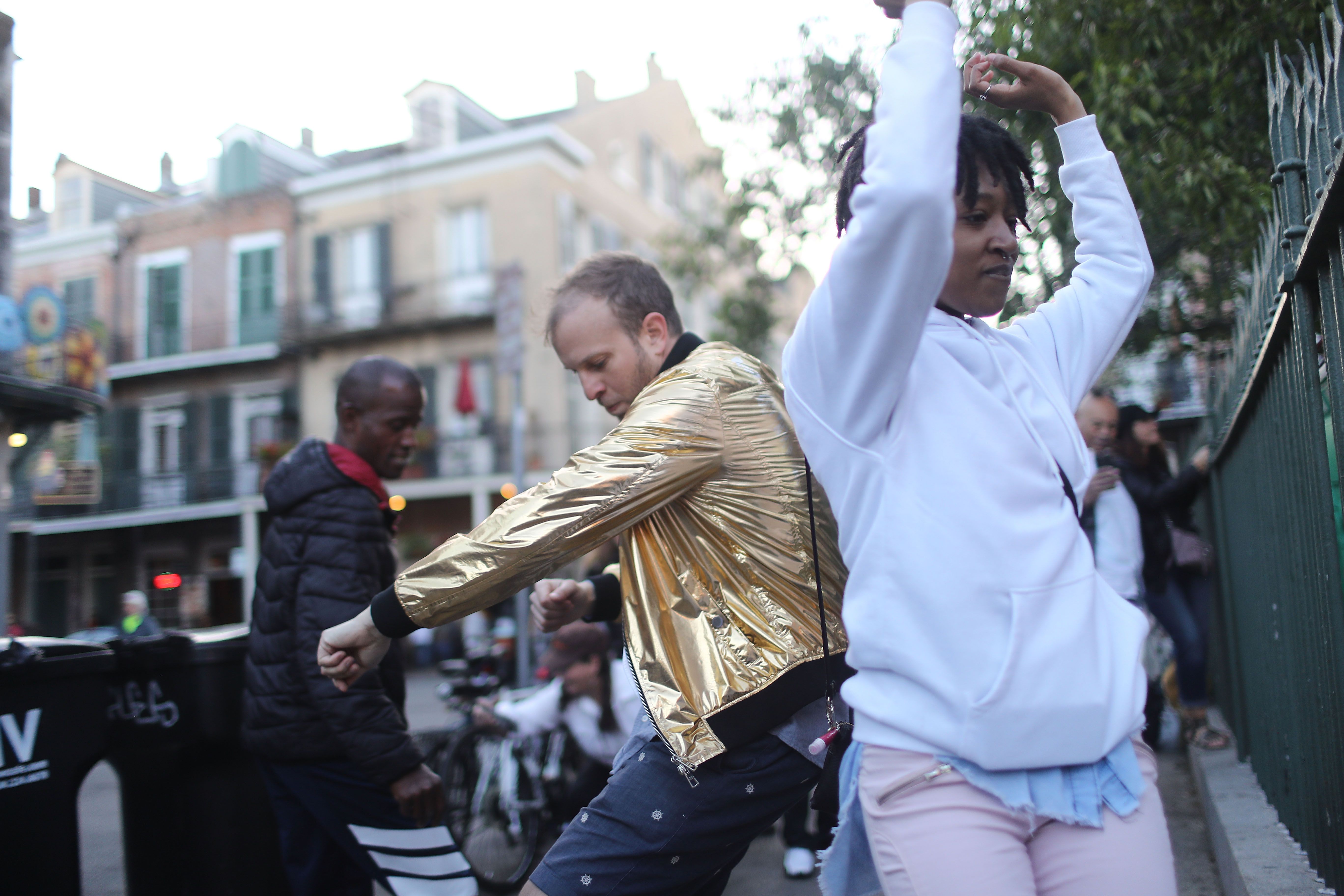 People dance in the French Quarter.
