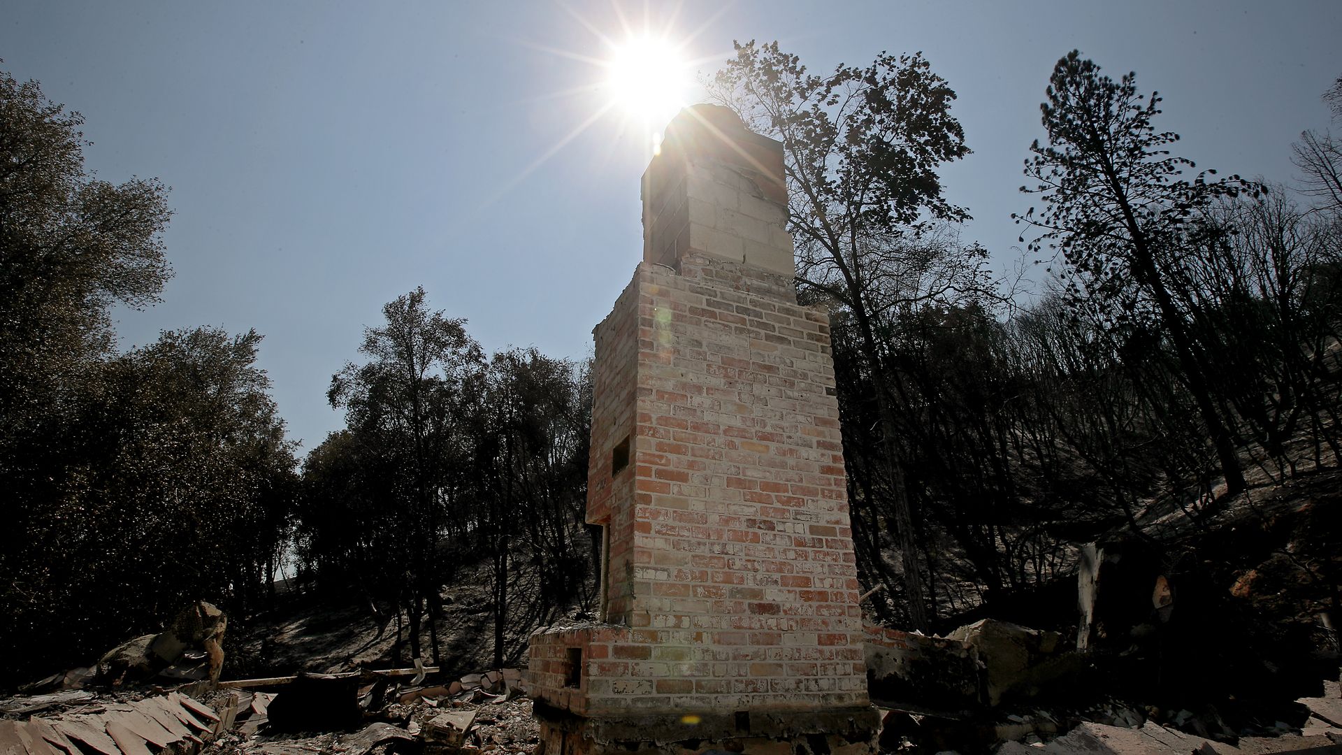 A chimney is all that remains of a residence burned by the Oak Fire near Mariposa on July 27.