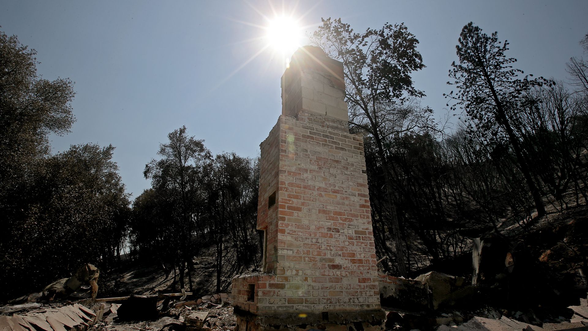 A chimney is all that remains of a residence burned by the Oak Fire near Mariposa on July 27.