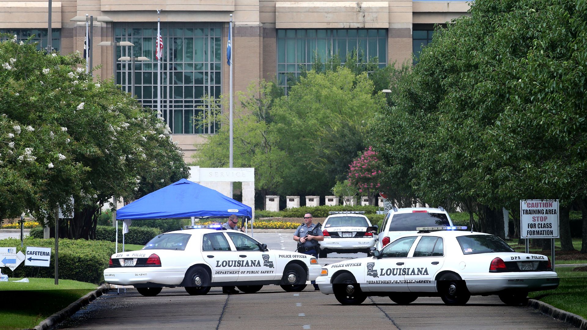 Photo of police cars parked in front of the Louisiana State Police building