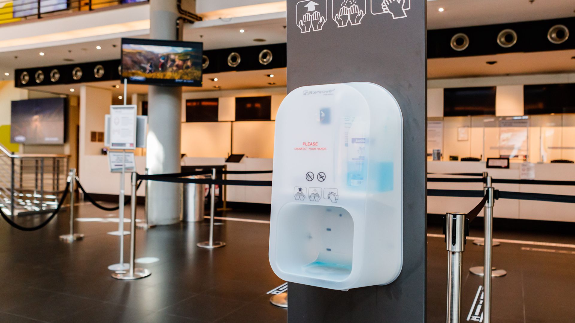 A hand sanitizer station in public