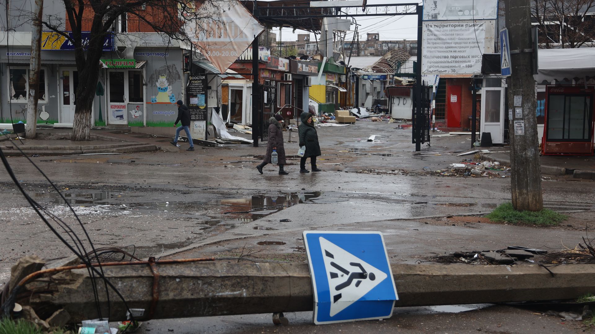 A view of damage in the street in the Ukrainian city of Mariupol under the control of Russian military and pro-Russian separatists, on April 13, 2022.
