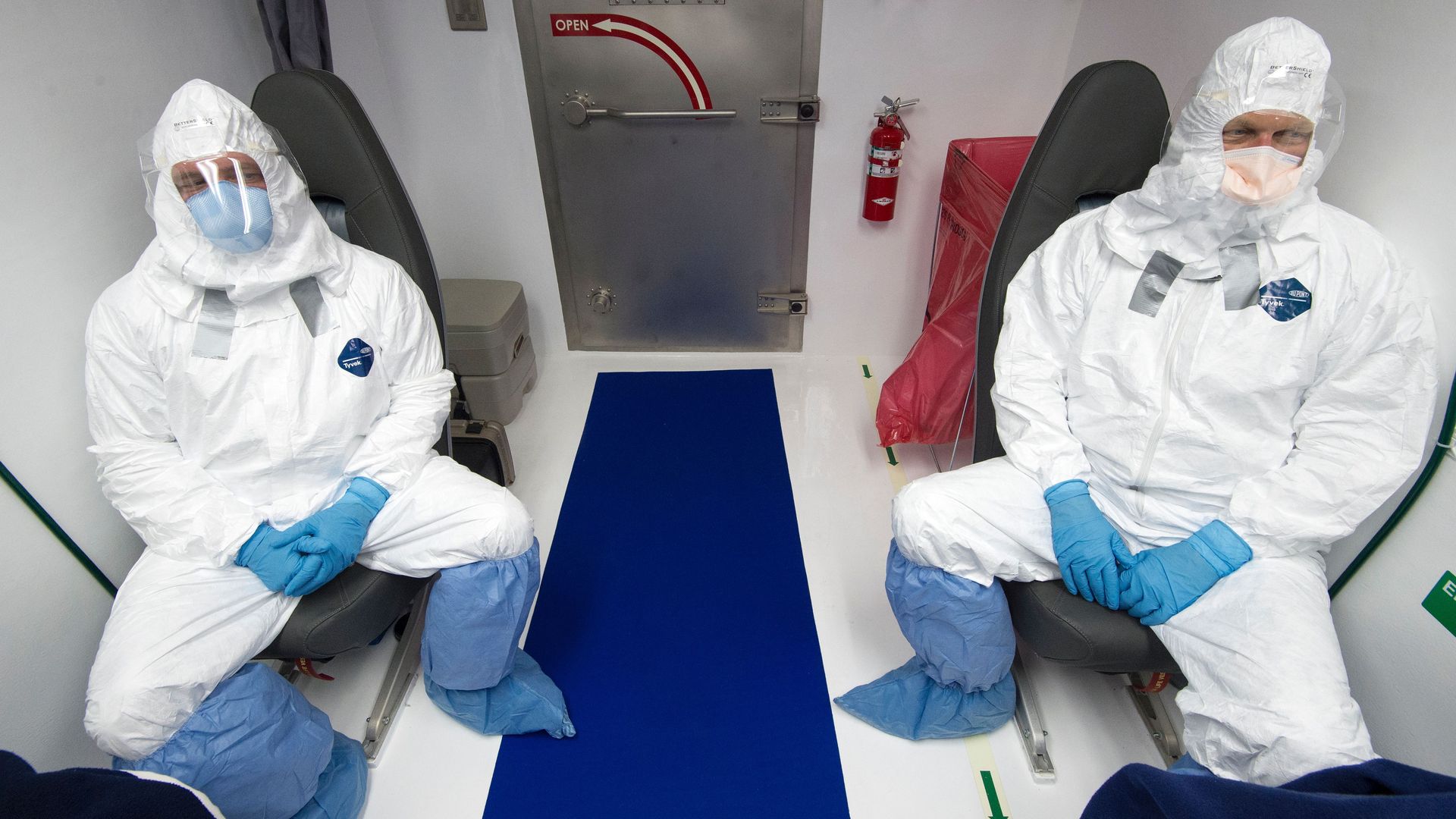 Members of a medical team monitor simulated patients infected with Ebola at Dulles International Airport.