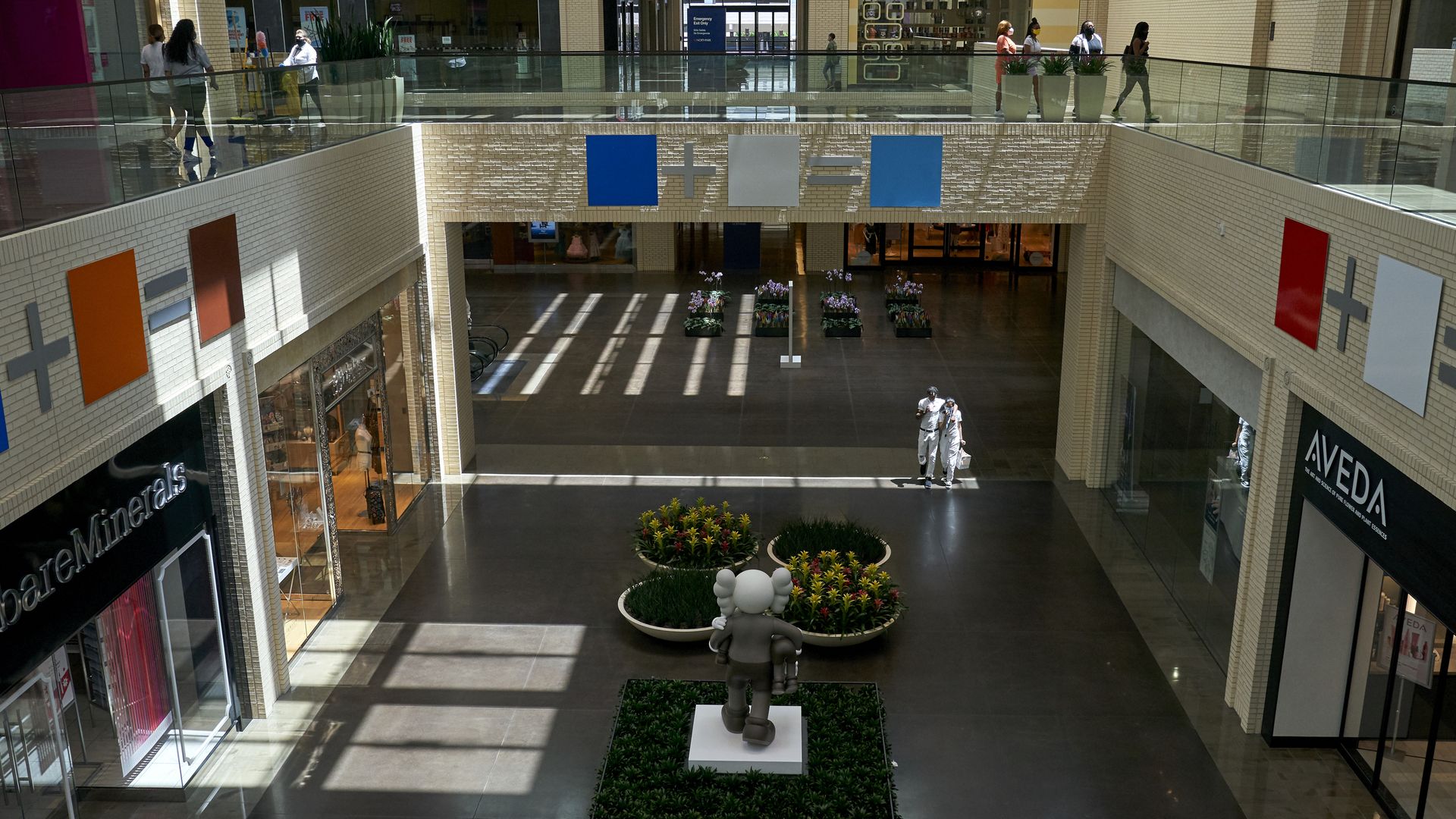 A photo of a mall with two stories 