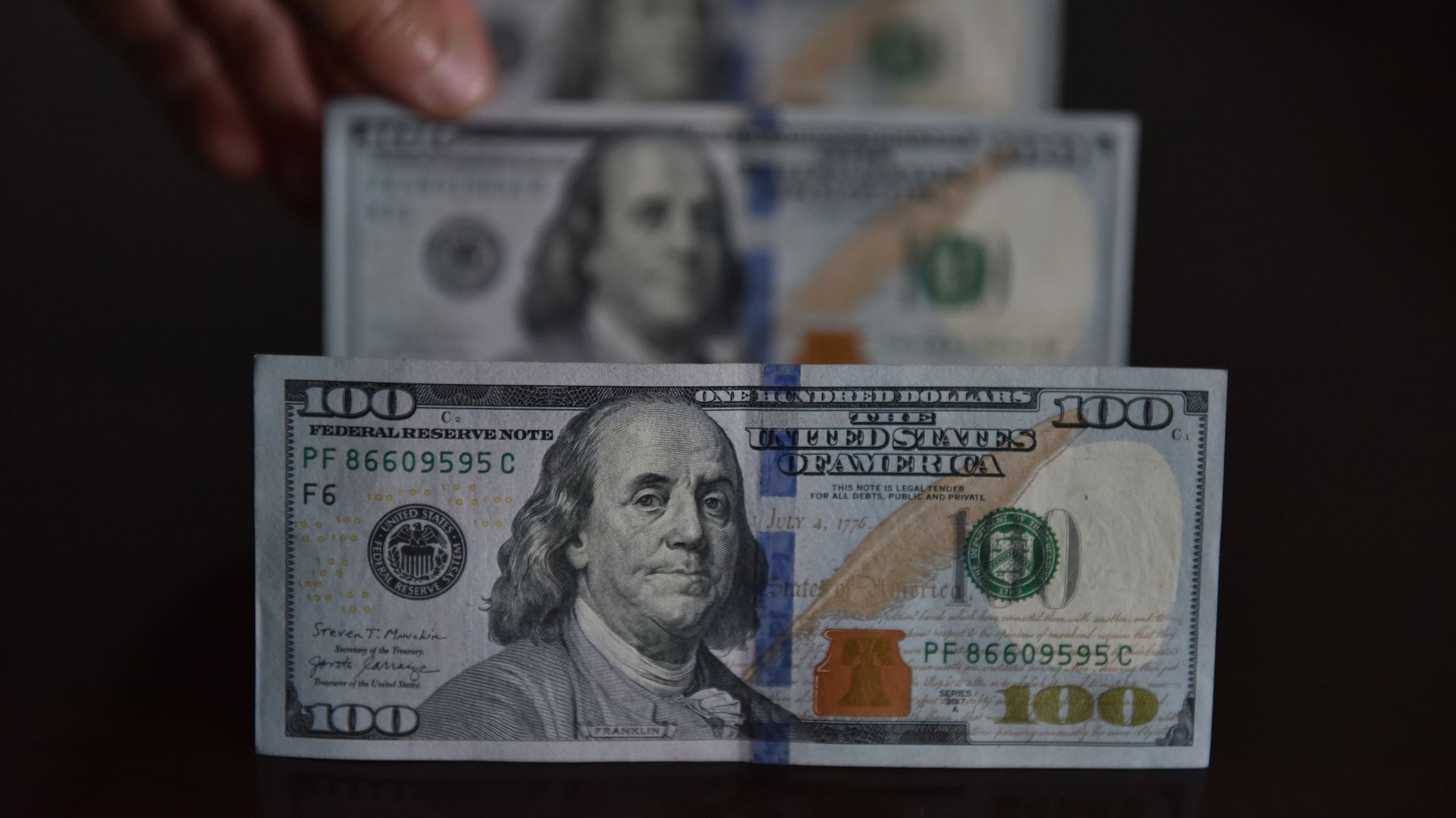 Photo taken on May 4, 2023 shows US dollar bills, Fuyang city, East China's Anhui Province.