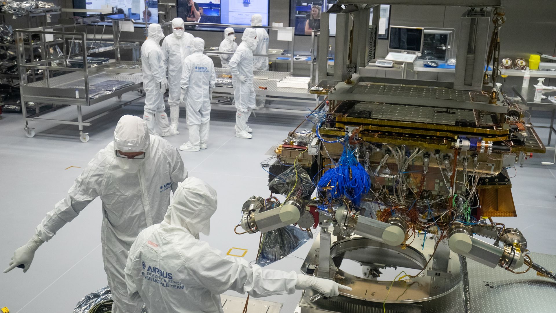 People working on European Space Agency's ExoMars rover in 2019.