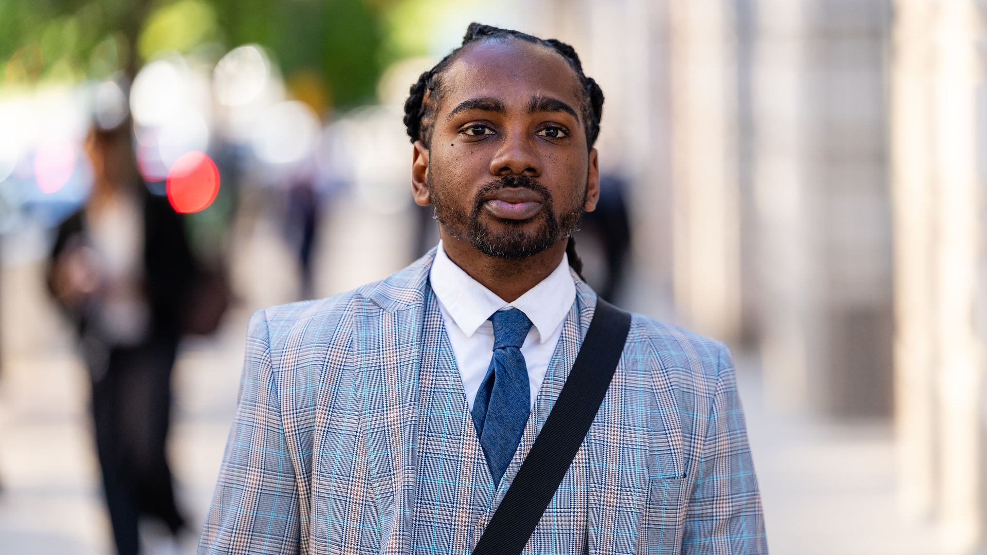 Trayon White is photographed walking on a street