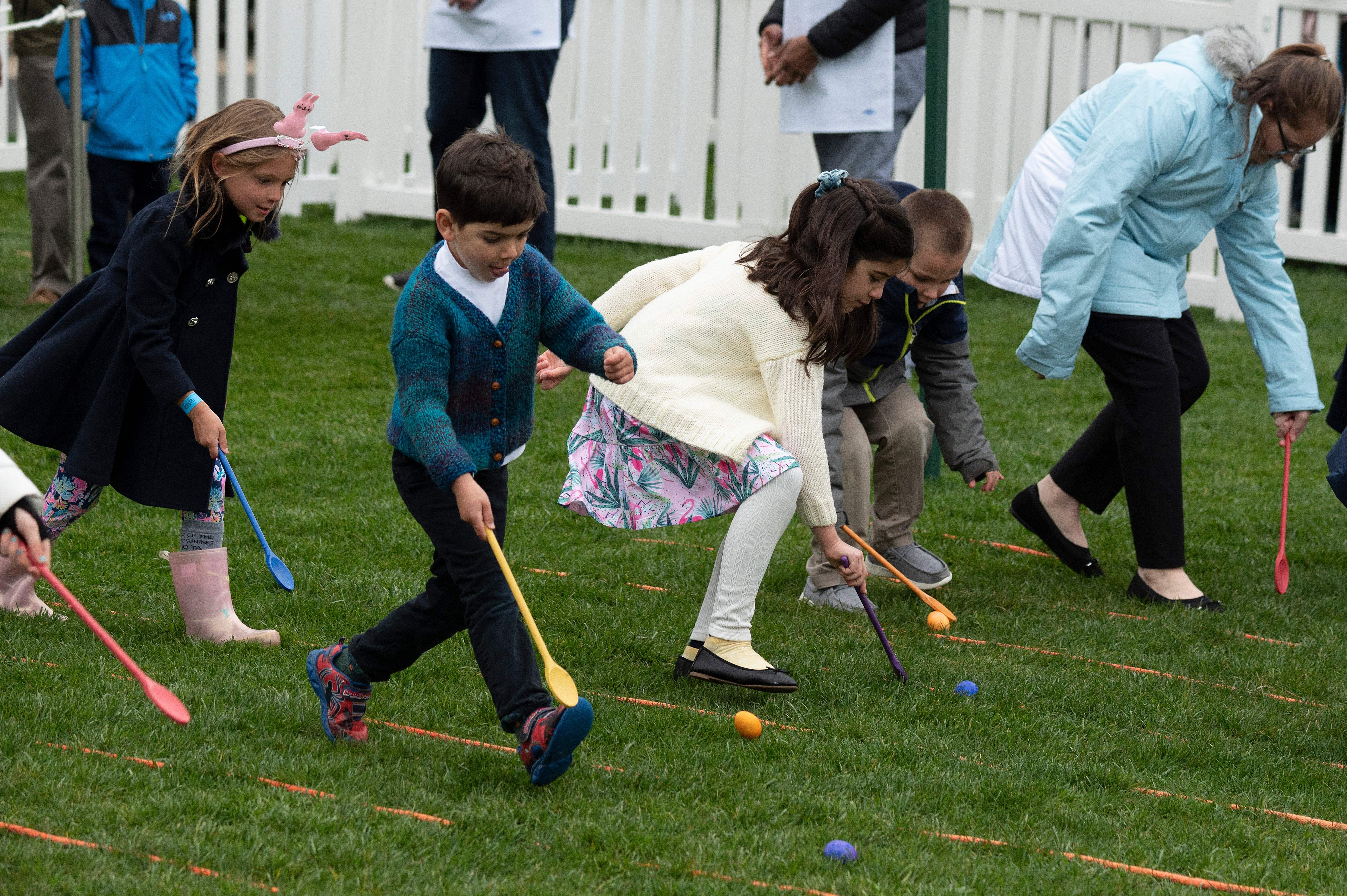 Kids participating in the egg roll