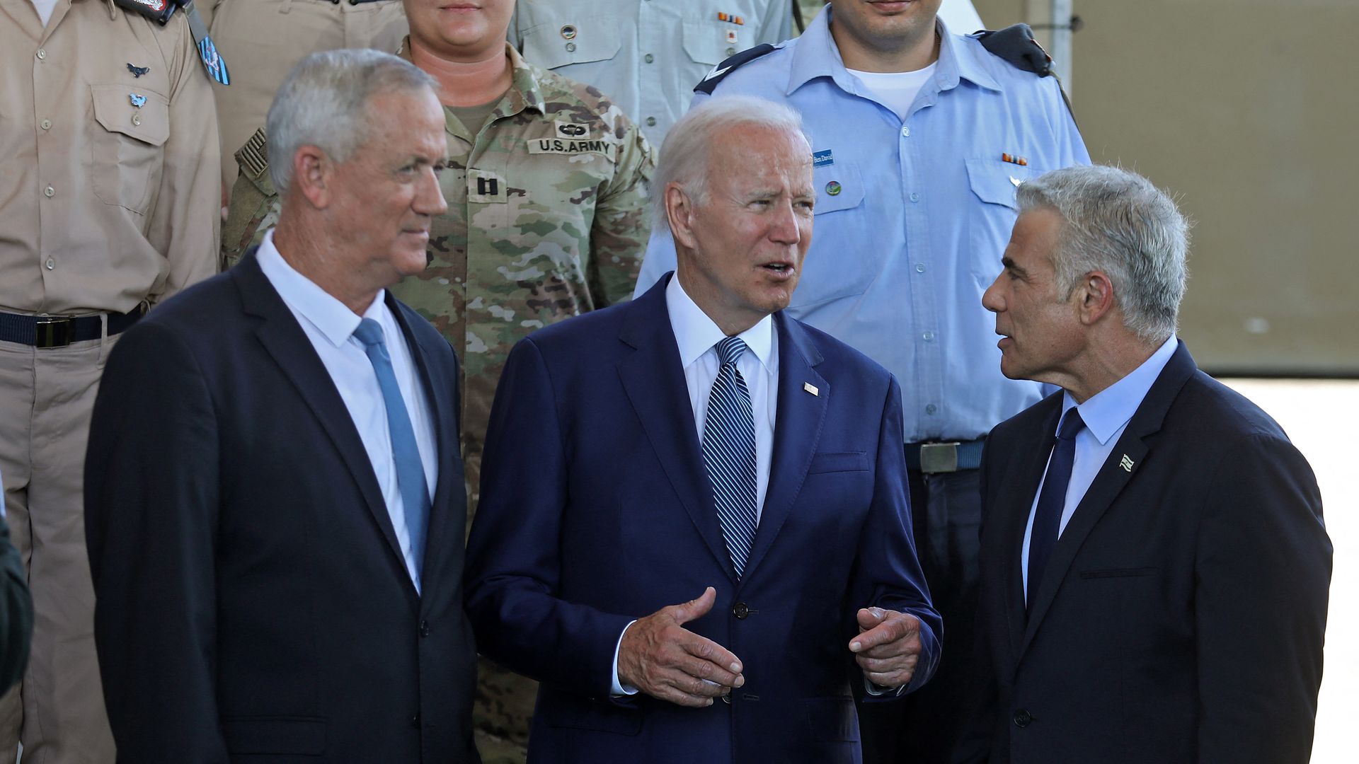 US President Joe Biden (C) and Israeli Defence Minister Benny Gantz (L), tour Israel's defence system at Ben Gurion Airport near Tel Aviv on July 13, 2022, with caretaker Prime Minister Yair Lapid (