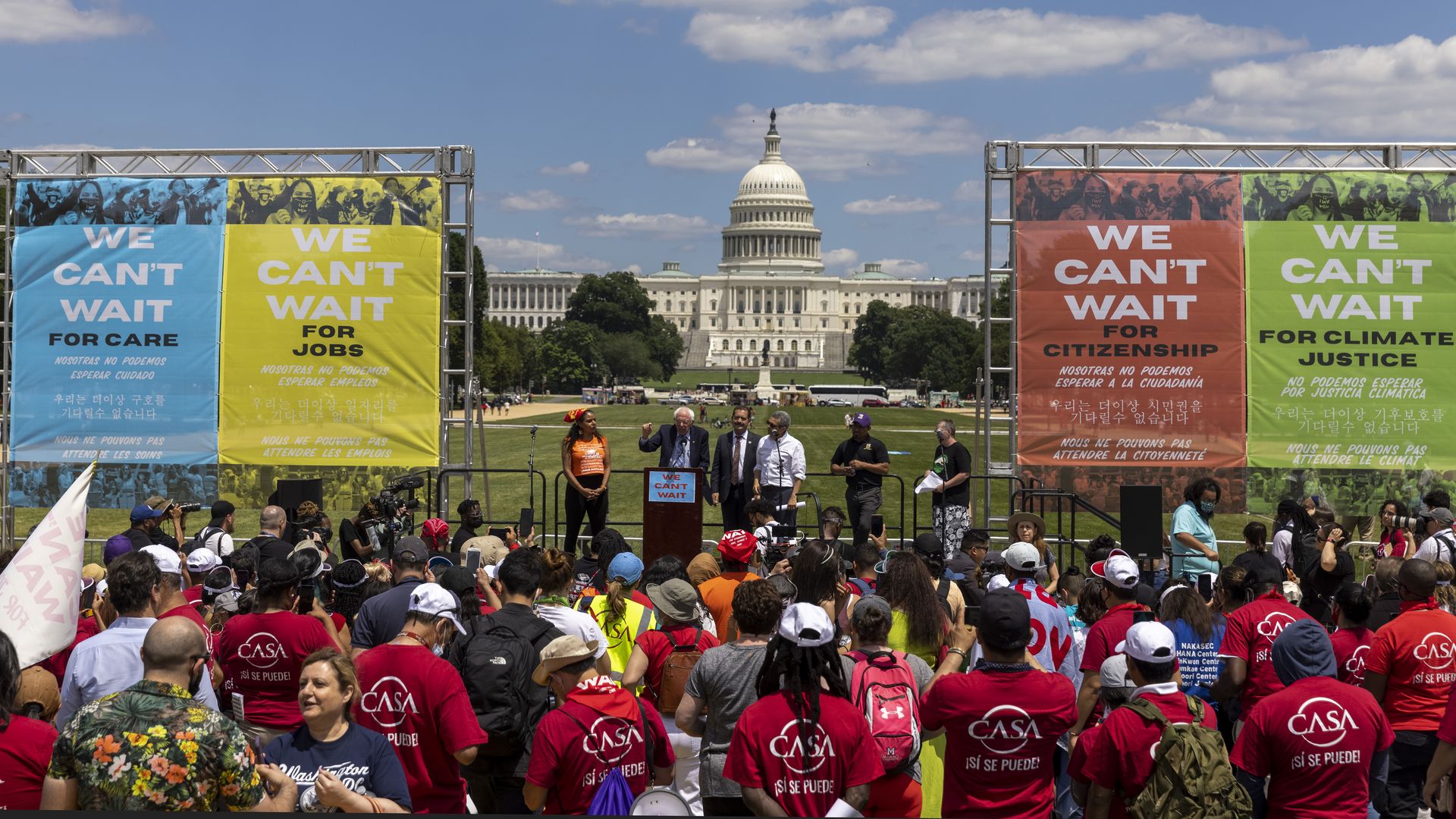 Sen. Bernie Sanders (I-VT) speaks to supporters of immigration reform with the Capitol in the background.
