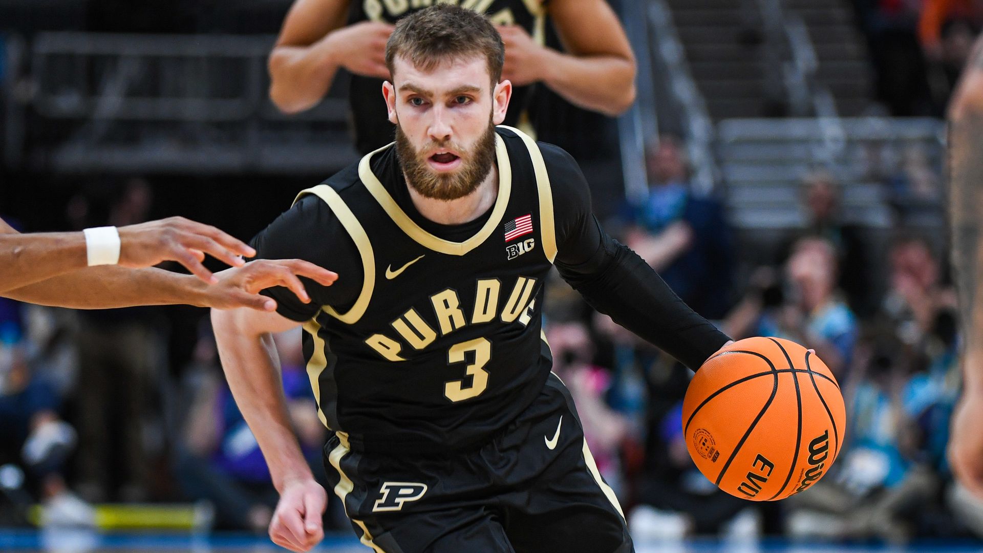 Braden Smith #3 of the Purdue Boilermakers dribbles the ball at the top of the key during the first half of a quarterfinals game of the Big Ten Men's Basketball Tournament against the Michigan Wolverines at Gainbridge Fieldhouse on March 14, 2025 in Indianapolis, Indiana.