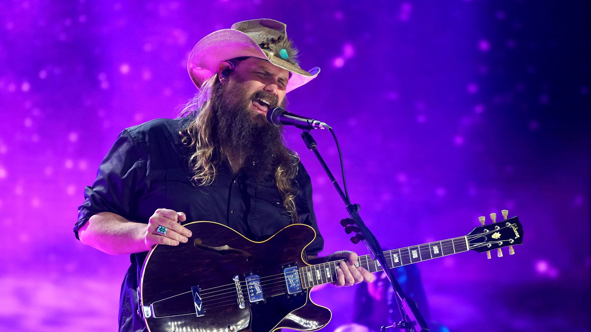 Chris Stapleton performing on stage.