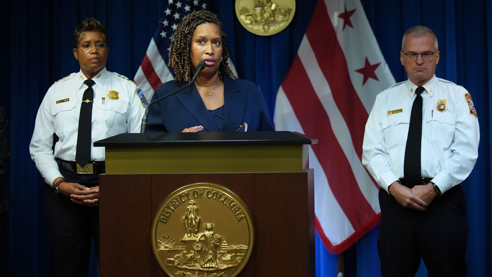 Washington, DC Mayor Muriel Bowser (C), joined by Chief of Police at the Metropolitan Police Department Pamela Smith (L) and Fire and Emergency Medical Services Chief Chief John Donnelly, speaks at a press conference after President Donald Trump announced a federal takeover of the Metropolitan Polic