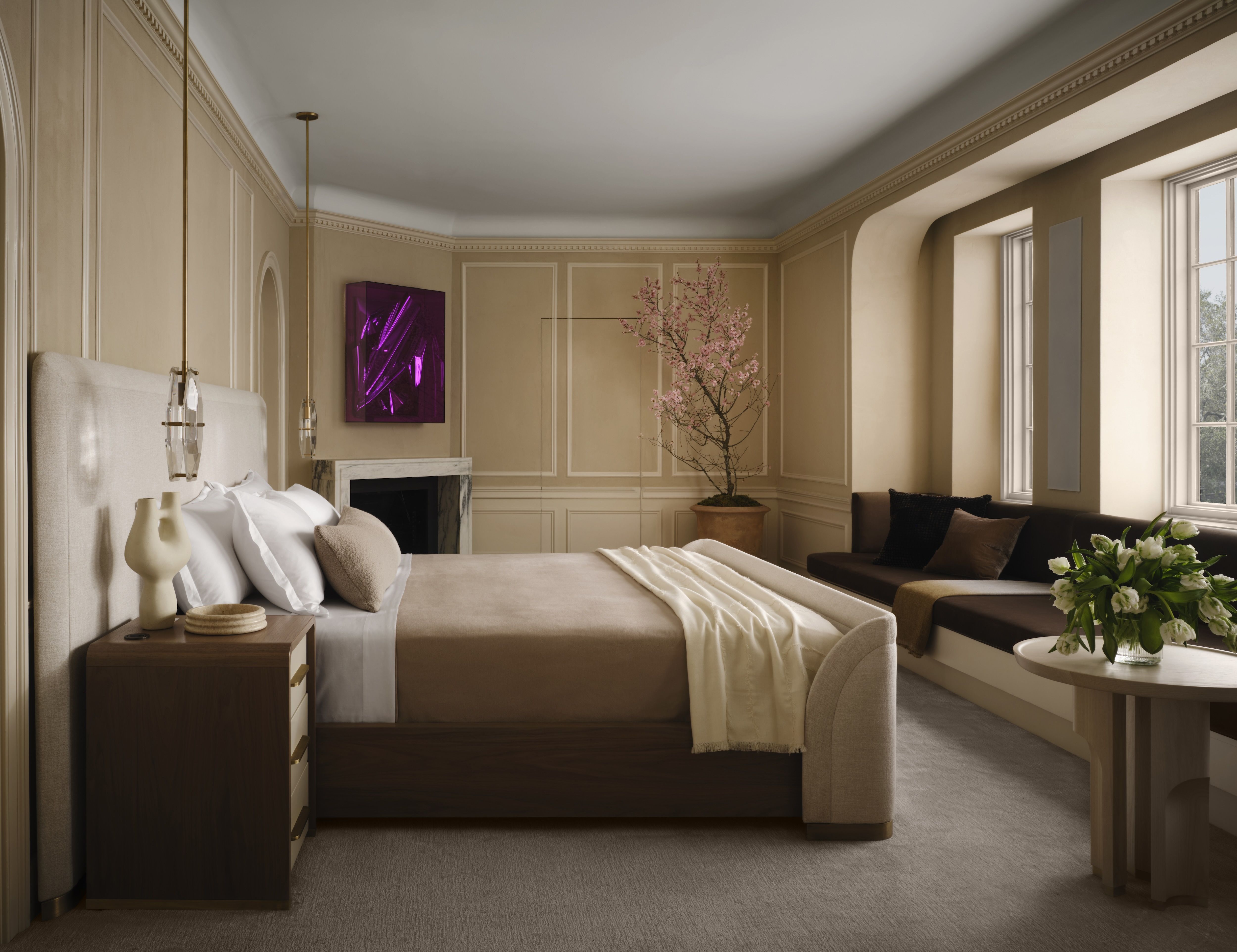 A photo showing a bed facing a wall of windows.