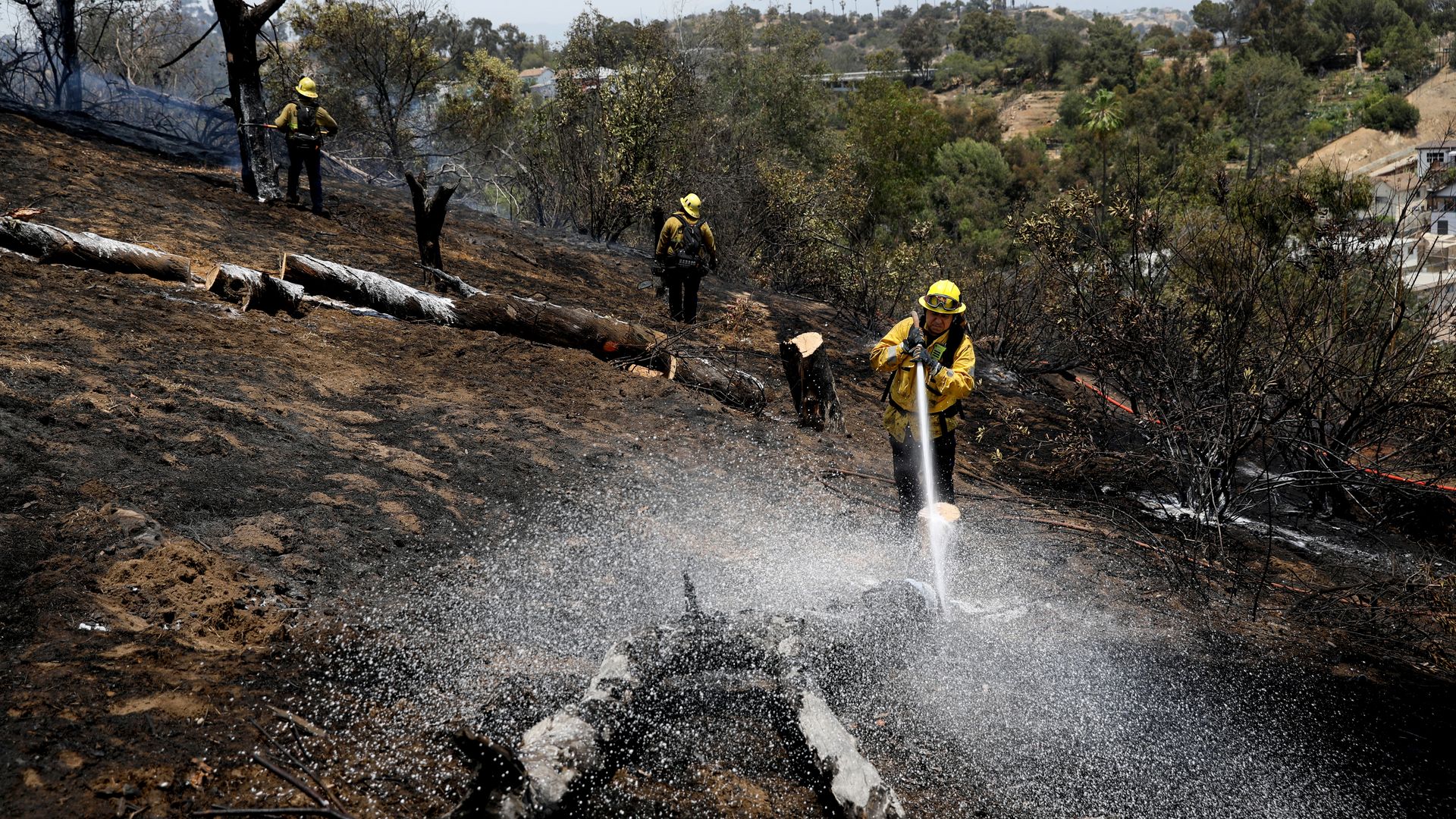 Los Angeles Fire Department mops up a brush fire in Elysian Park on Wednesday, June 16, 2021