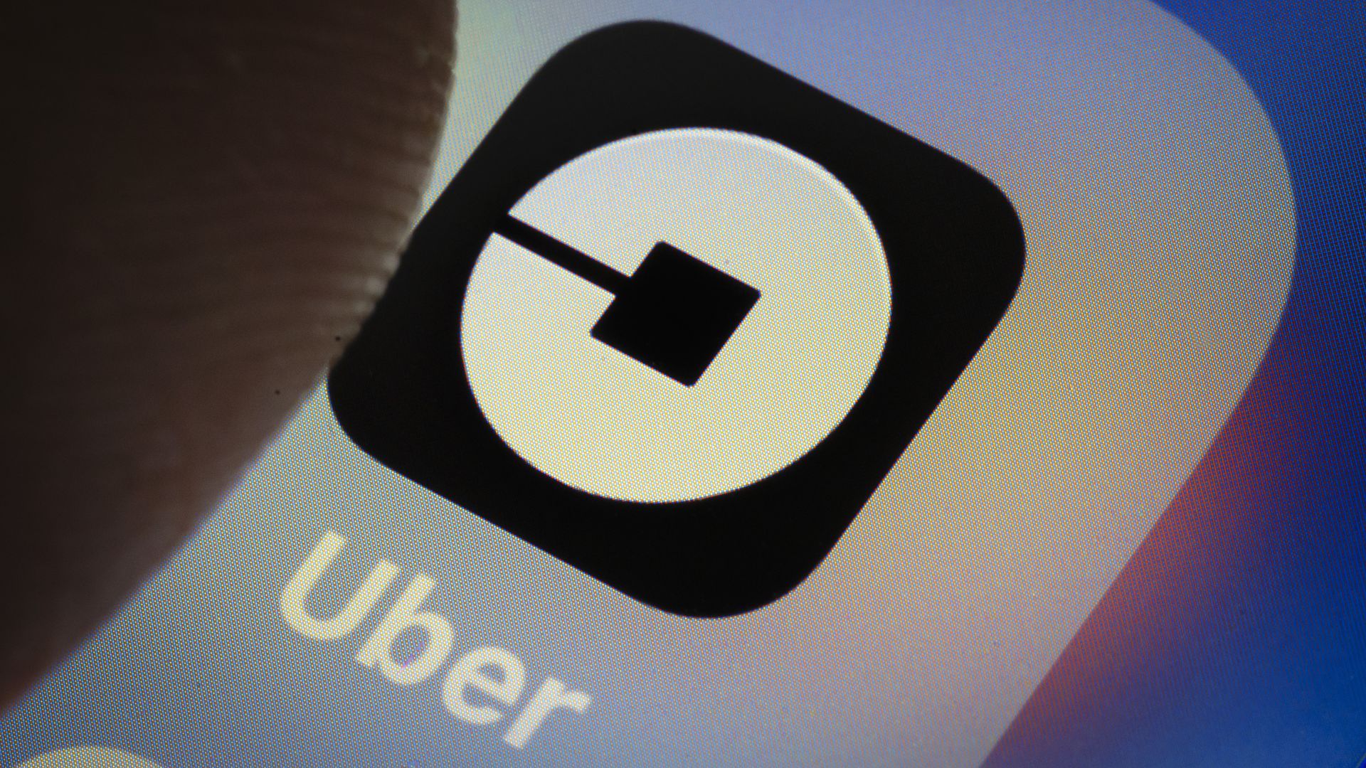 Uber app logo on smartphone.