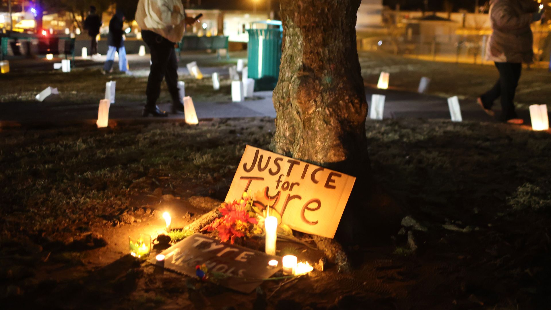 Candles and a sign for Tyre Nichols.