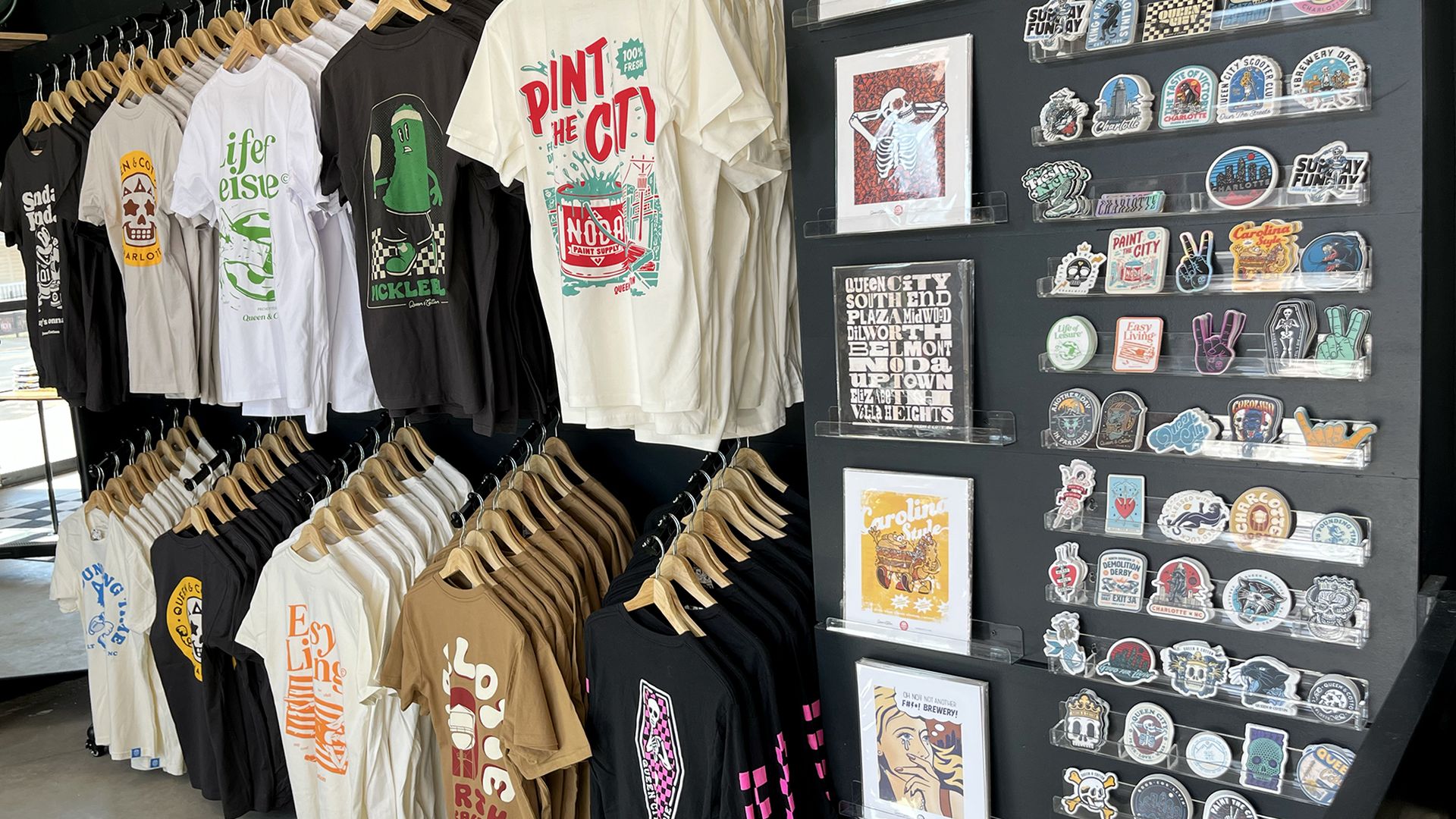 T-shirts hanging on the wall of a store