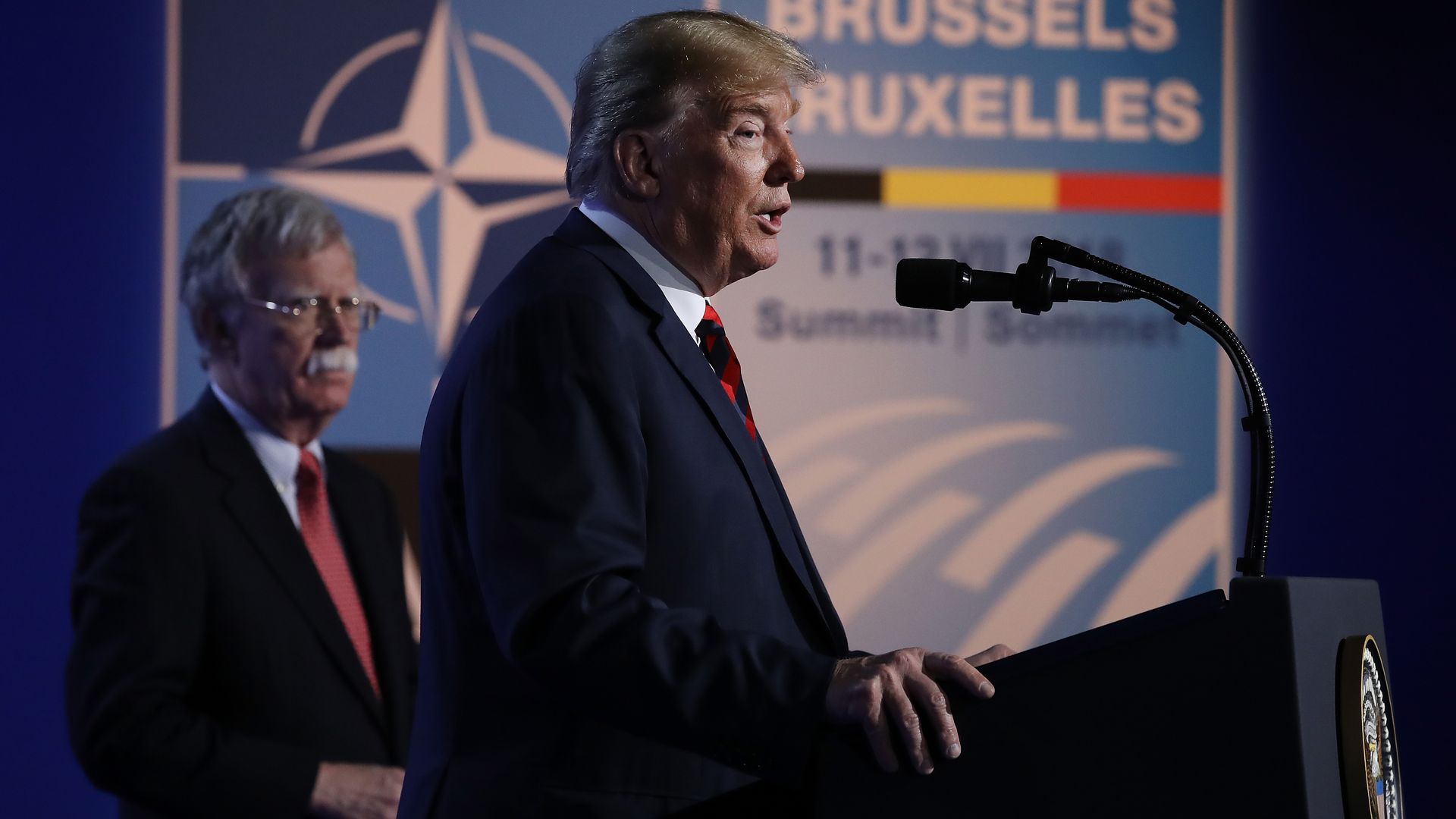 John Bolton and Donald Trump on stage