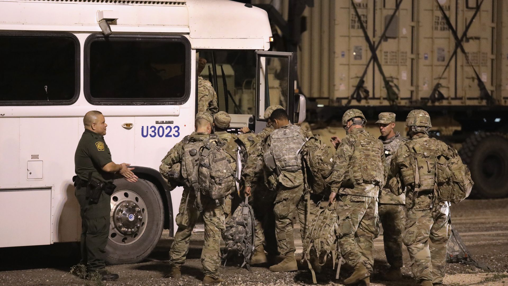 Troops at the border getting into a bus