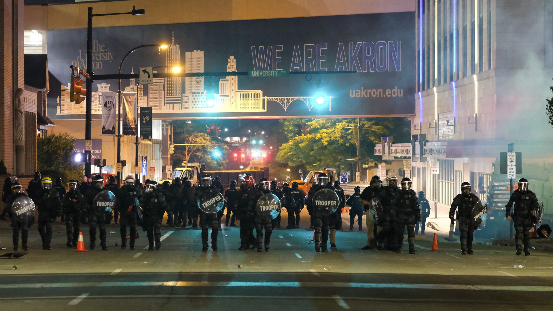 Troopers in riot gear and police officers deployed tear gas and stun grenades.