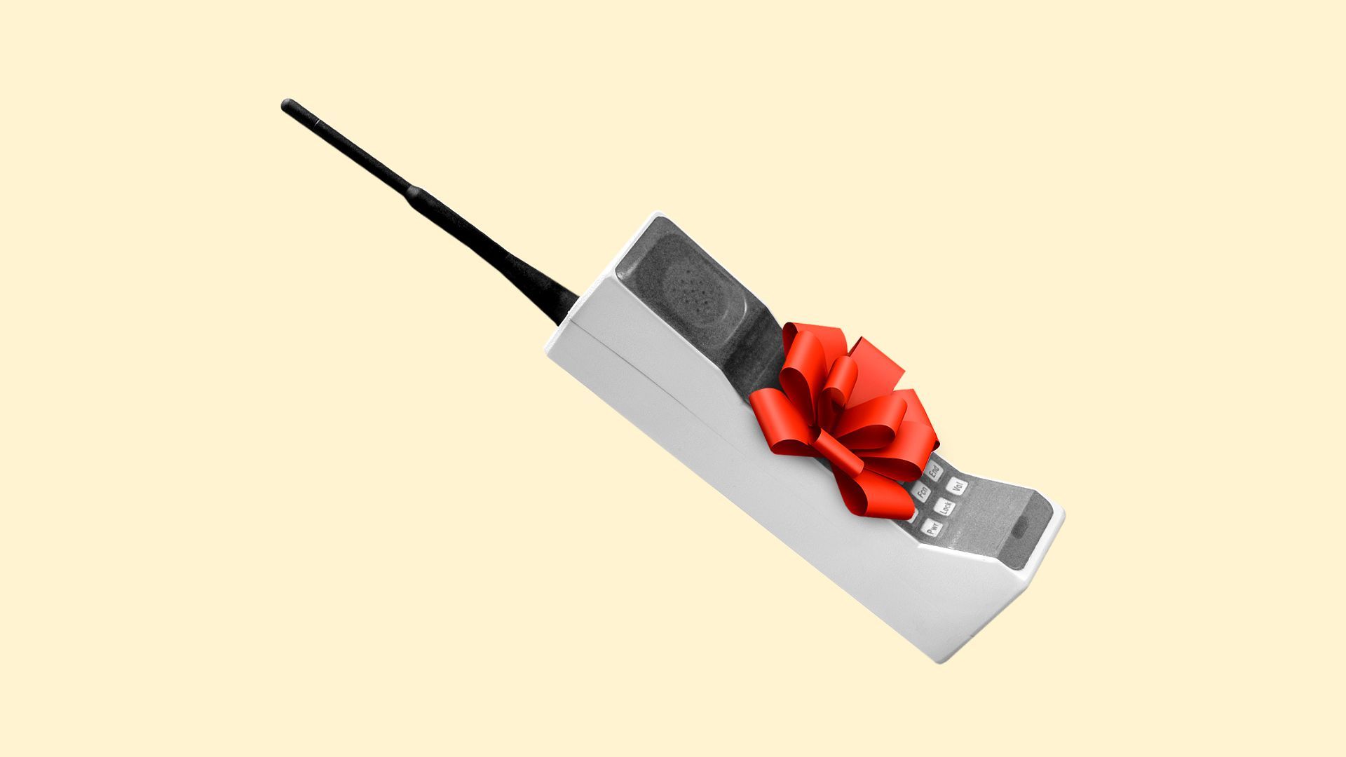 An old cell phone with a bow on it