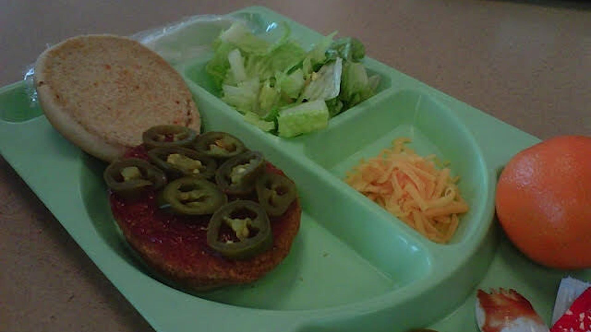 Chicken sandwich on a tray.