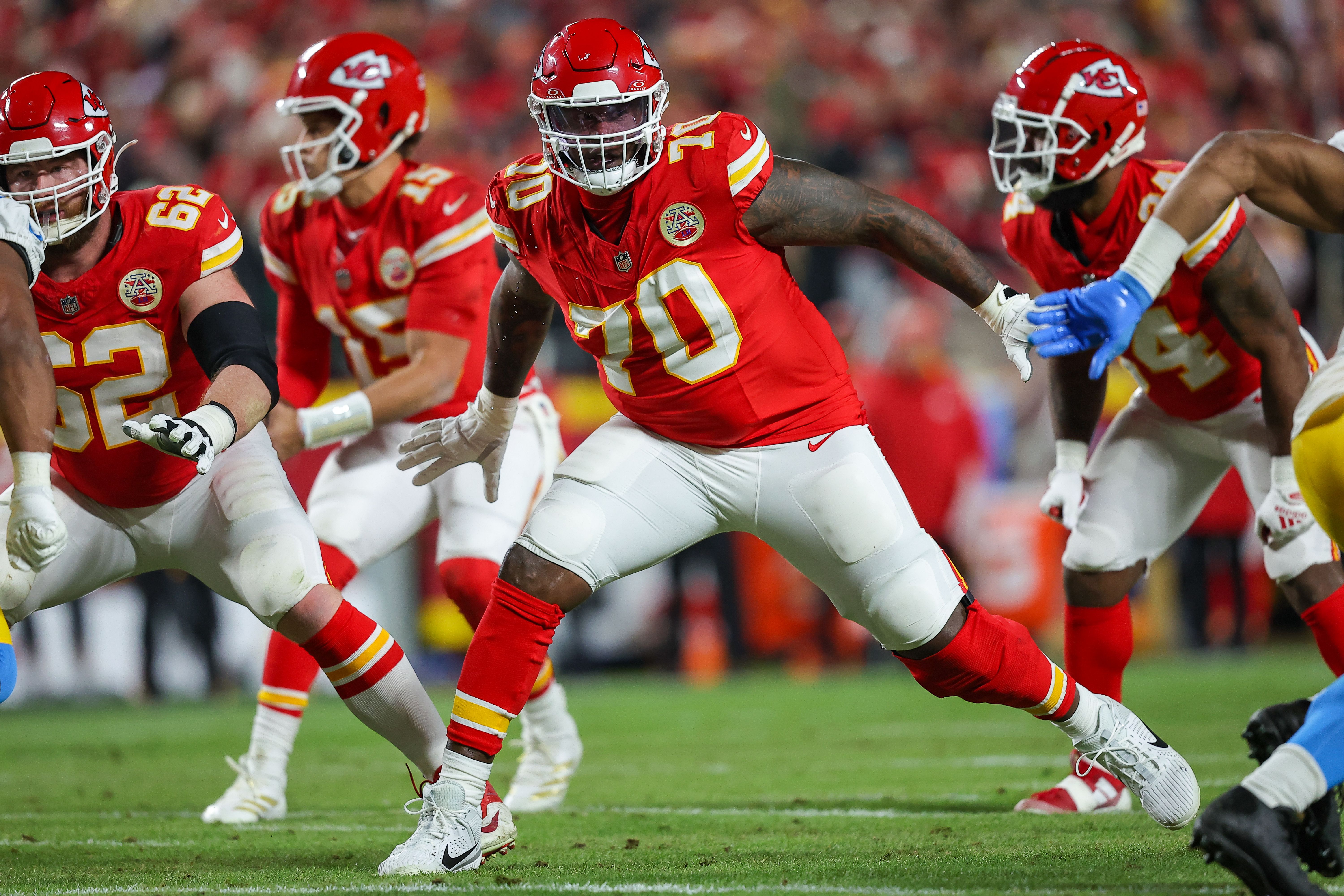 D.J. Humphries #70 of the Kansas City Chiefs prepares to block during the second quarter against the Los Angeles Chargers at GEHA Field at Arrowhead Stadium on December 8, 2024 in Kansas City, Missouri. (Photo by David Eulitt/Getty Images)