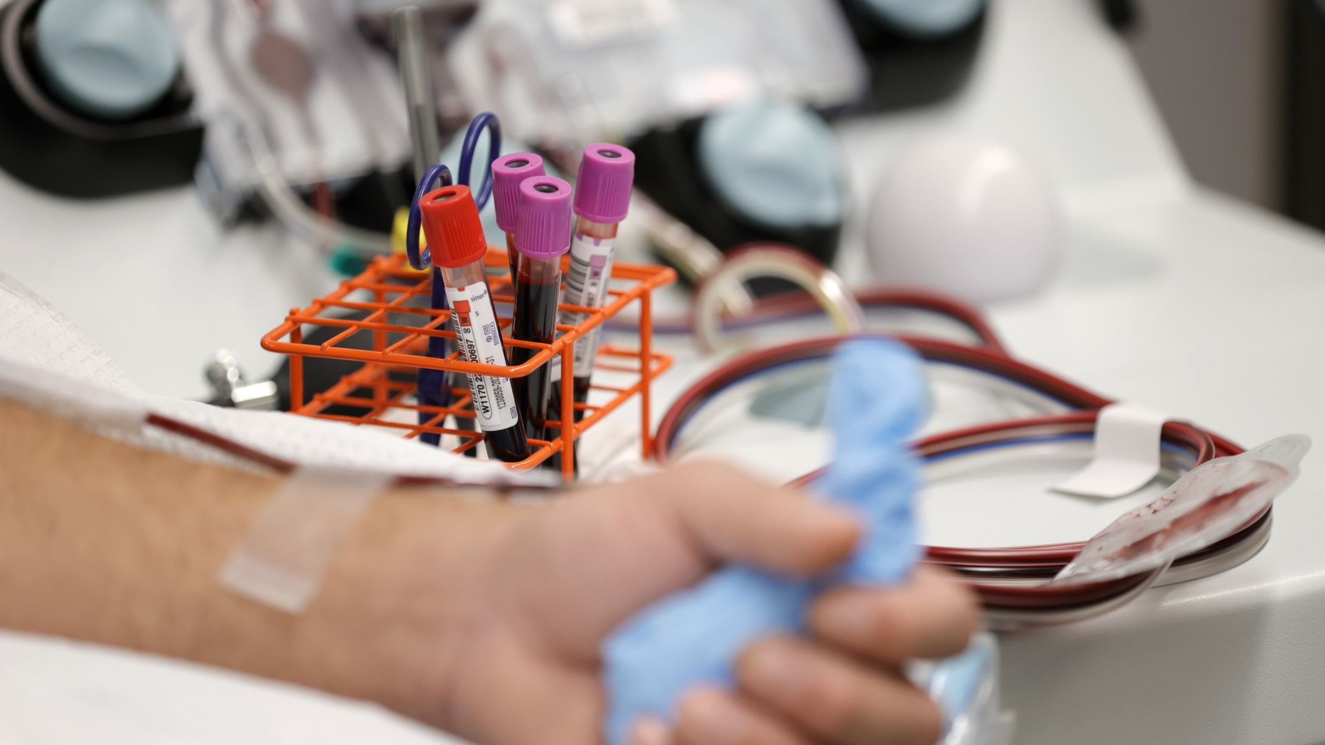 Vials of blood sit on a table as Oscar Platero doantes blood at Vitalant blood donation center on January 11, 2022 in San Francisco, California