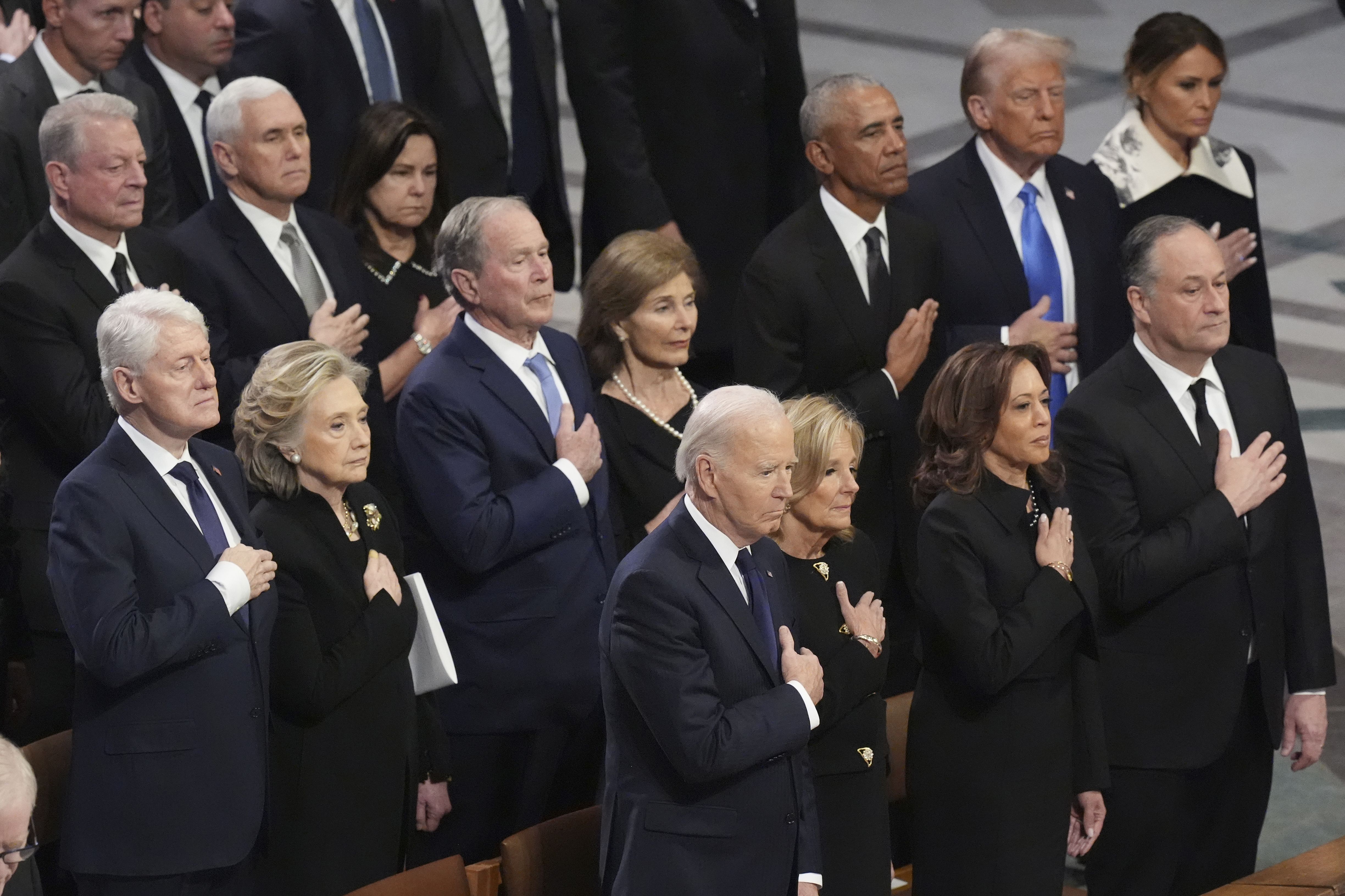 Front row, from left, President Joe Biden, first lady Jill Biden, Vice President Kamala Harris and second gentleman Doug Emhoff and second row from left, former President Bill Clinton, former Secretary of State Hillary Clinton, former President George W. Bush, Laura Bush, former President Barack Oba