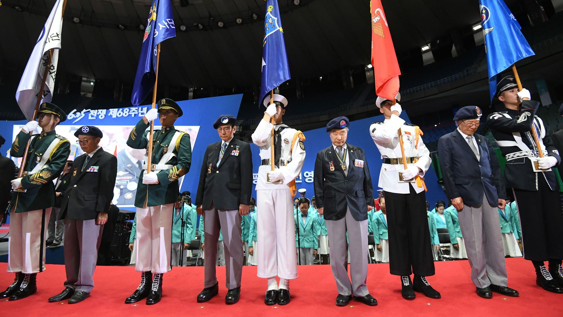 South Korean war veterans pay silent tribute during a ceremony marking the 68th anniversary of the outbreak of the Korean War in Seoul on June 25, 2018.