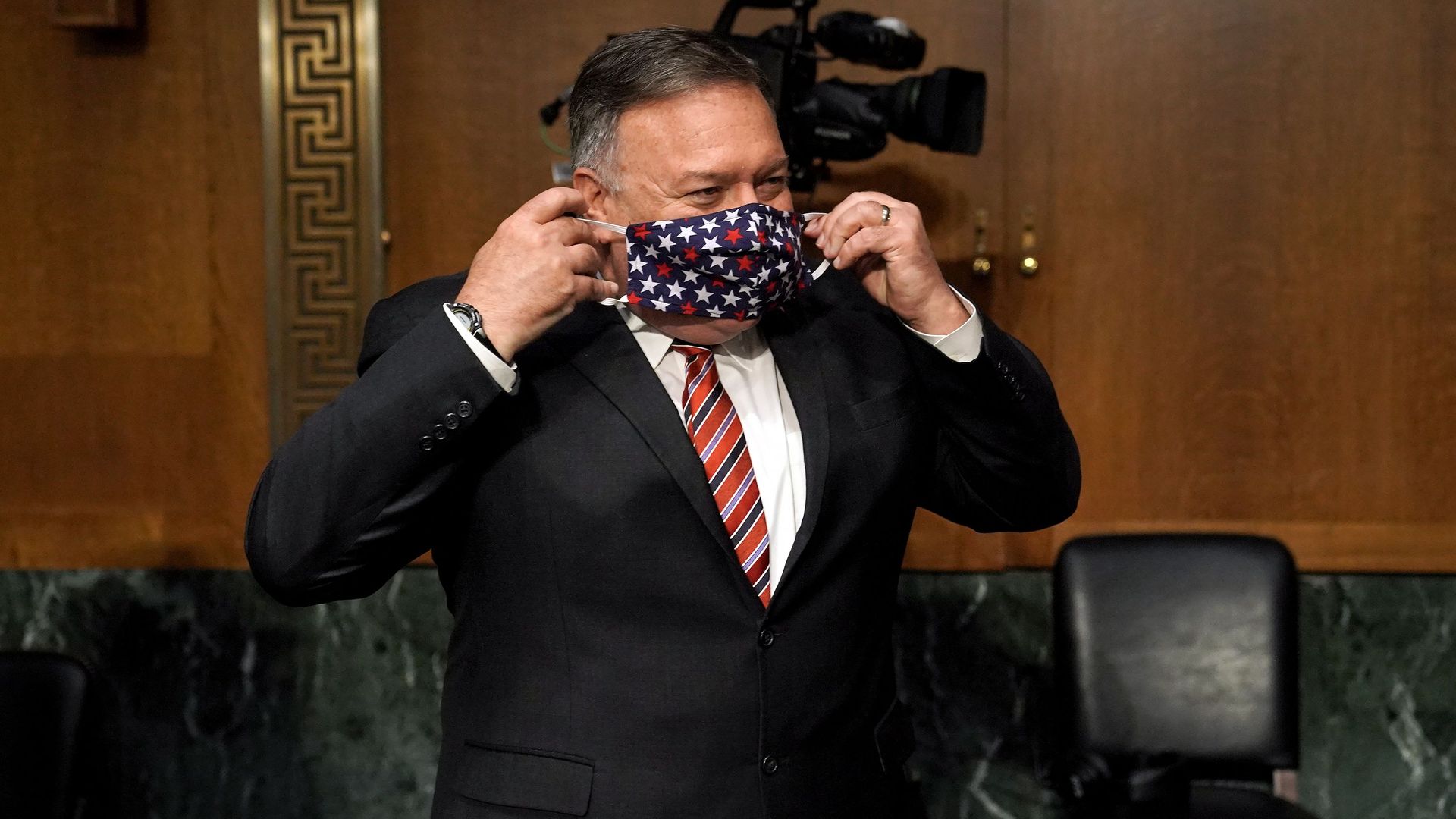 Pompeo wears a mask