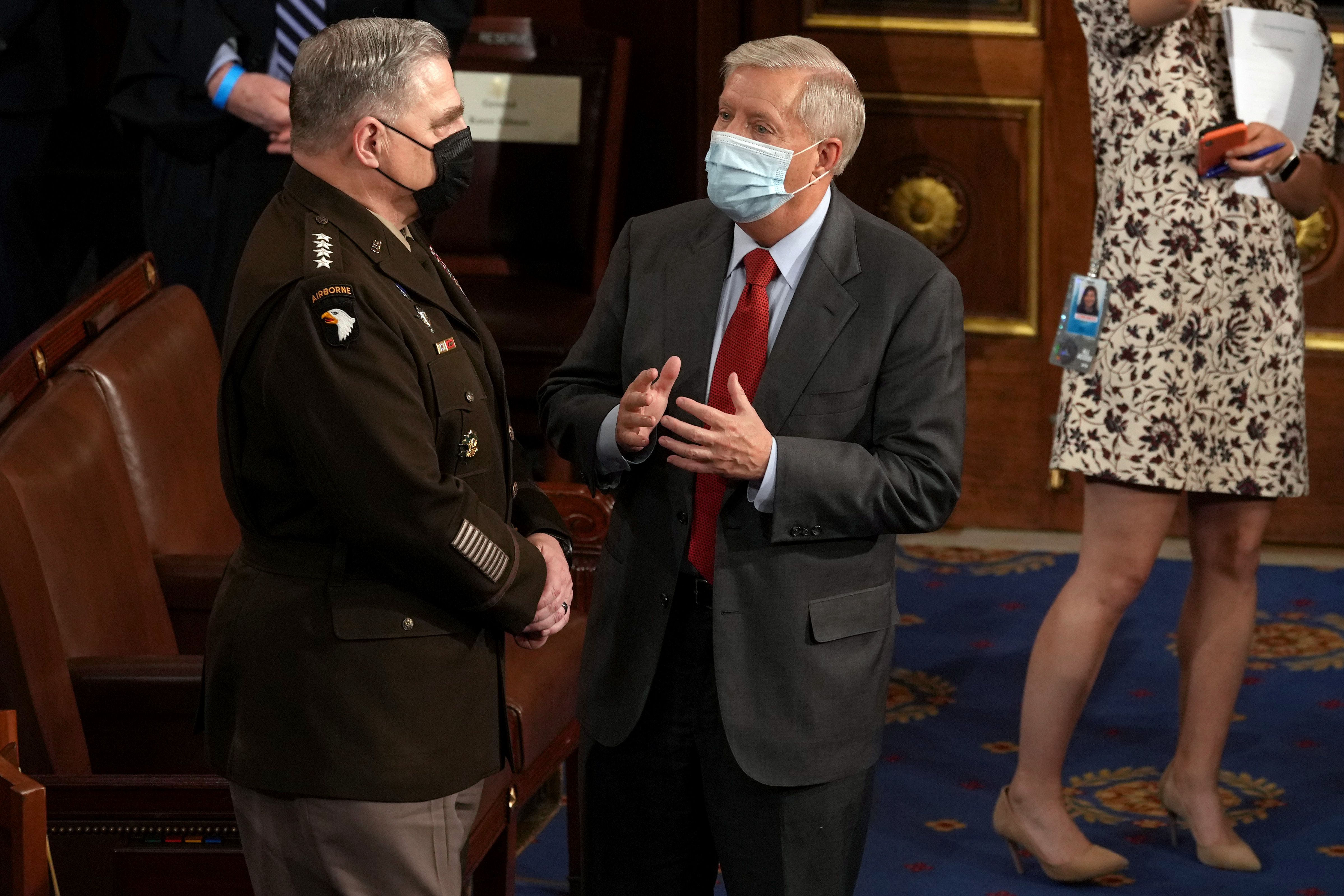 Senator Lindsey Graham, a Republican from South Carolina, right, speaks with Mark Milley, chairman of the joint chiefs of staff, before a joint session of Congress