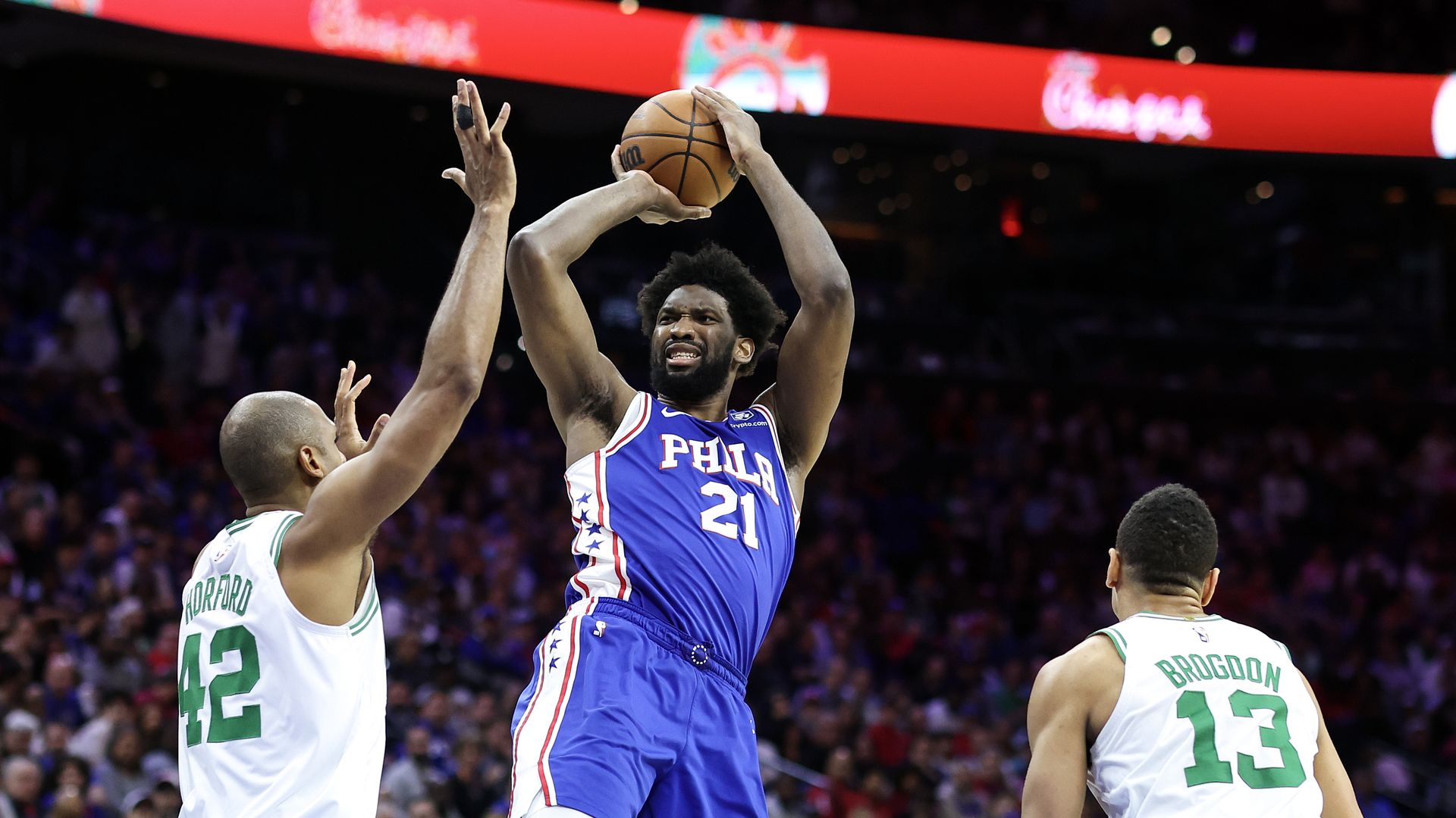 The Sixers' Joel Embiid shoots over Boston's Al Horford.