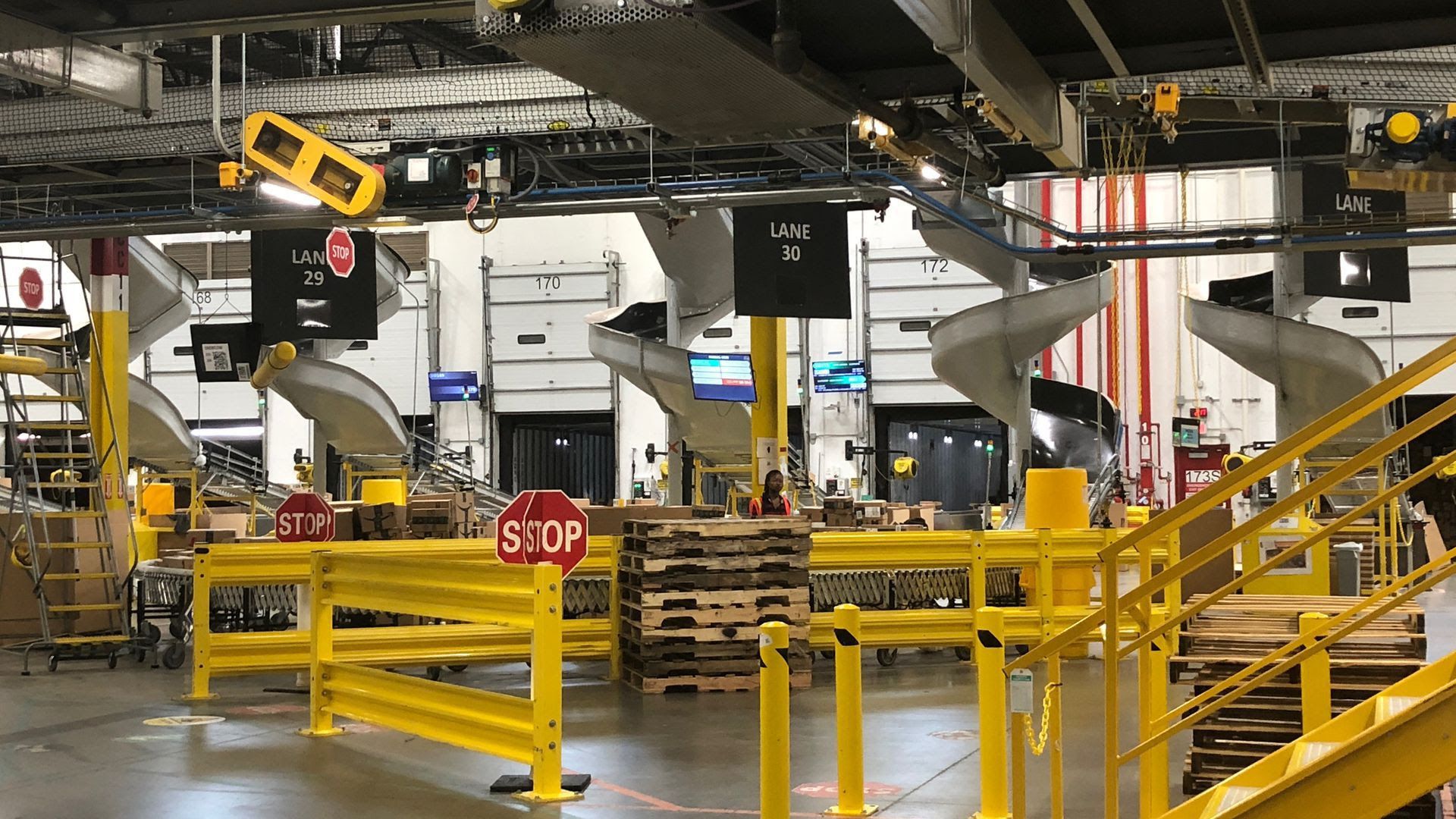 A row of slides deliver packages to be loaded onto trucks
