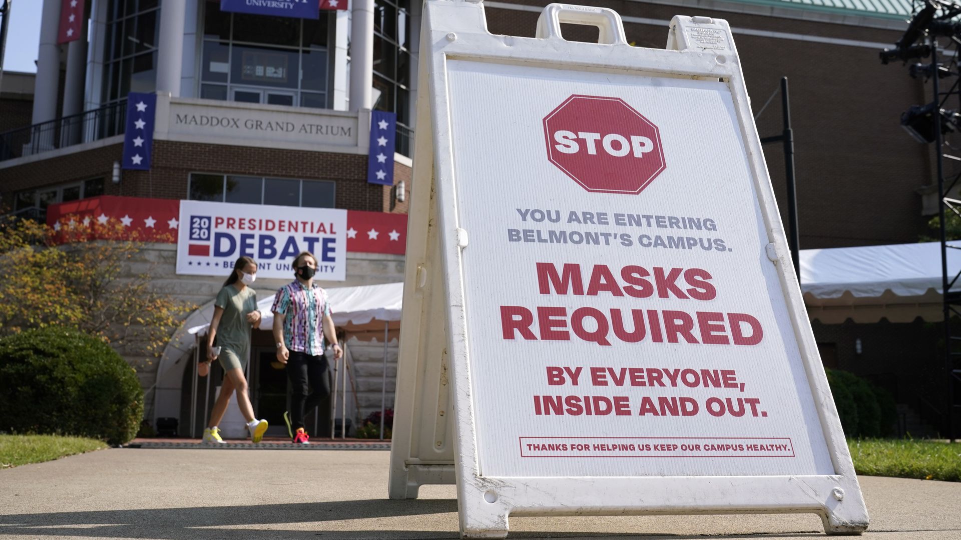 A sign mandating wearing masks greets visitors outside the venue for the second presidential debate.