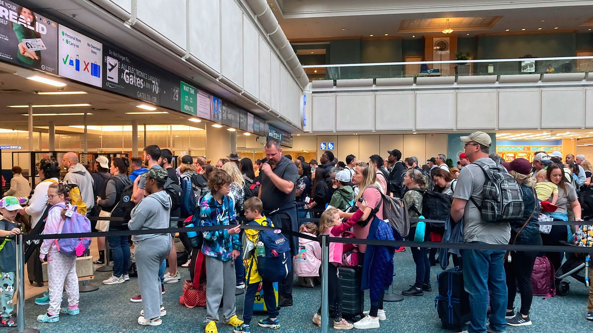 People waiting in a TSA screening line at Orlando International Airport in November 2021.
