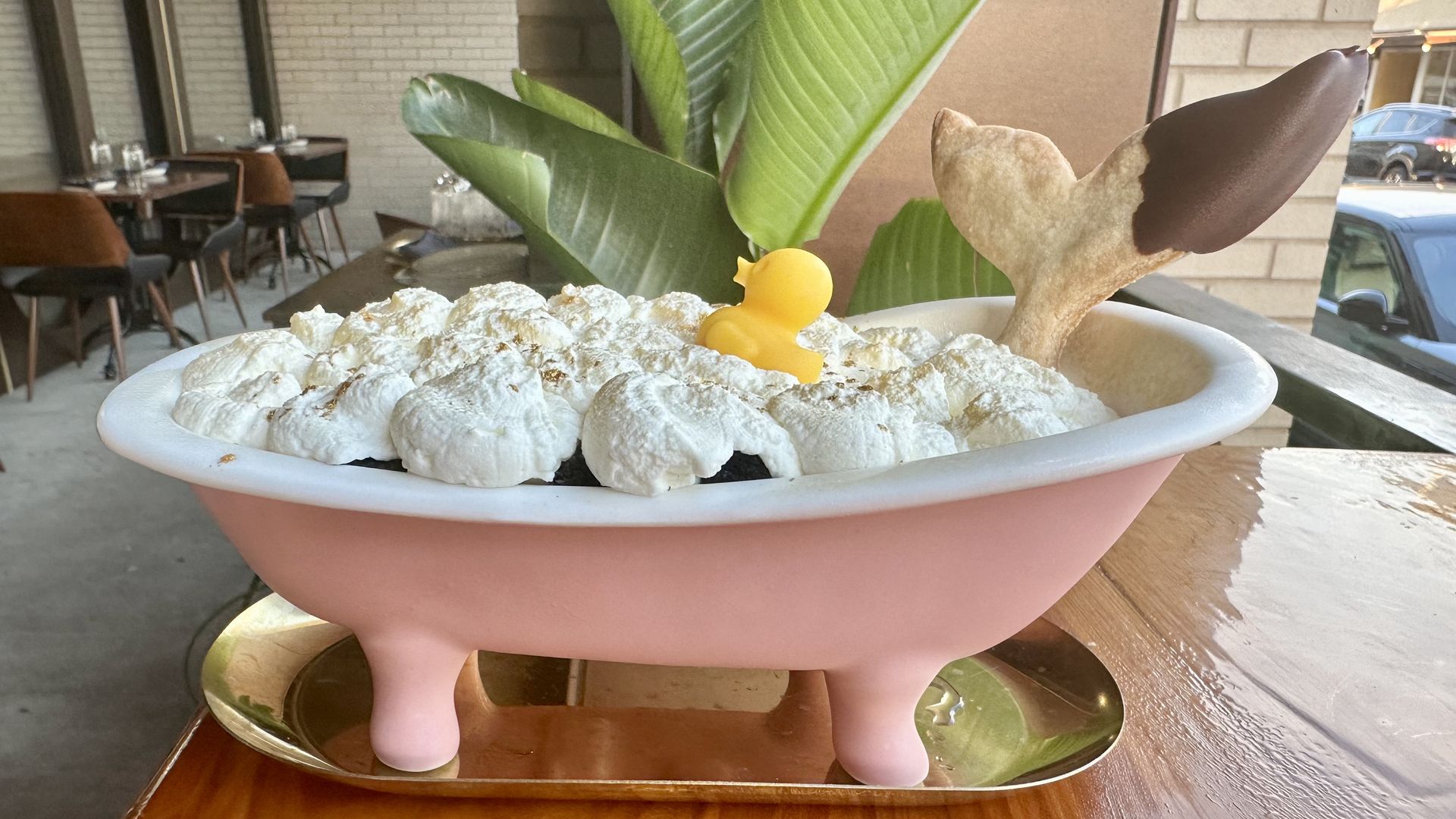 Photo shows a chocolate mousse dessert in a Barbie bathtub