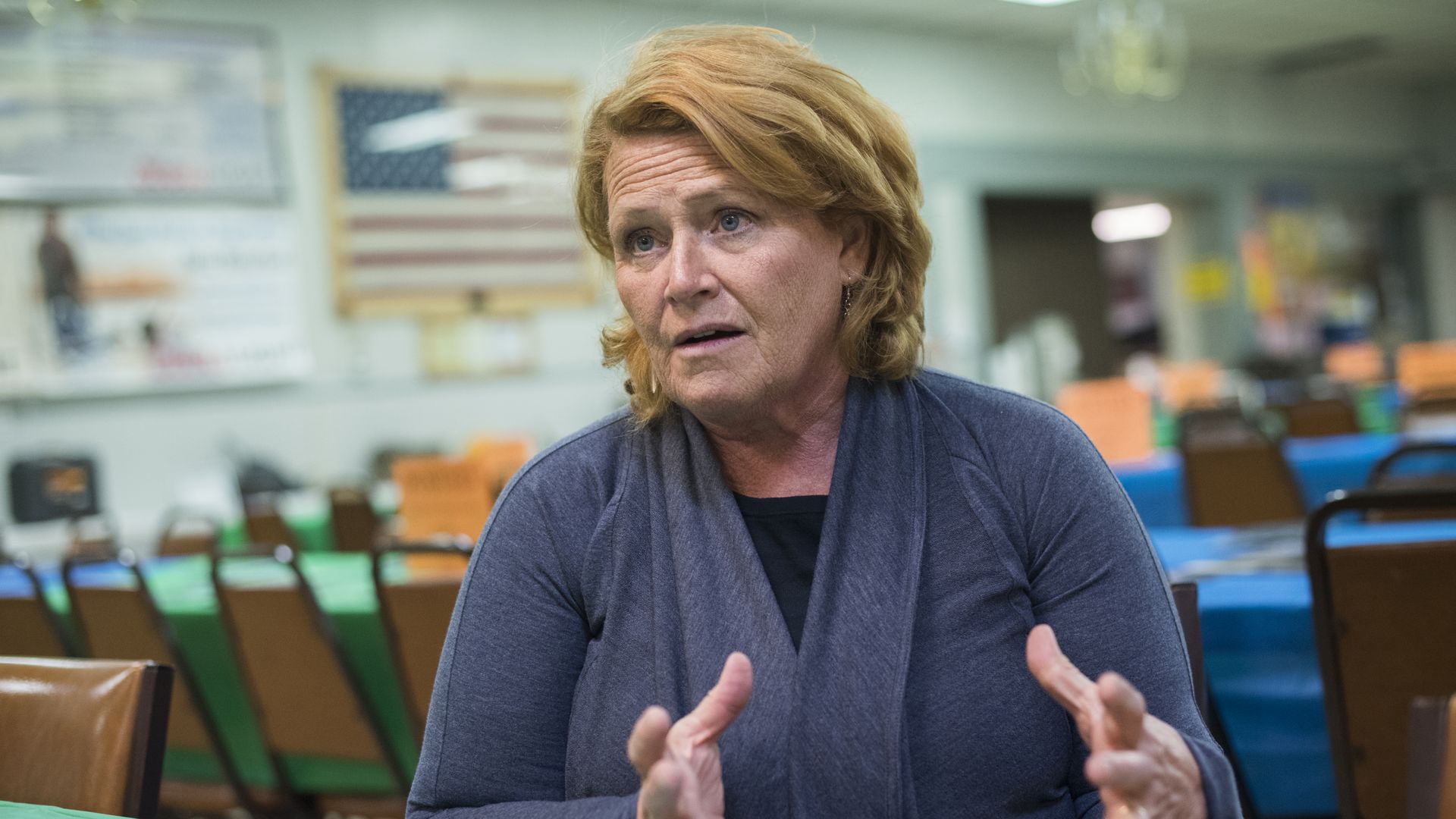 Heidi Heitkamp looks upset and gestures.
