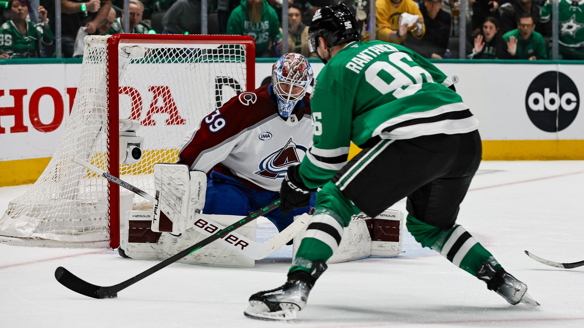 Mikko Rantanen wearing a Dallas Stars jersey with the number 96 scores a goal on the Colorado Avalanche