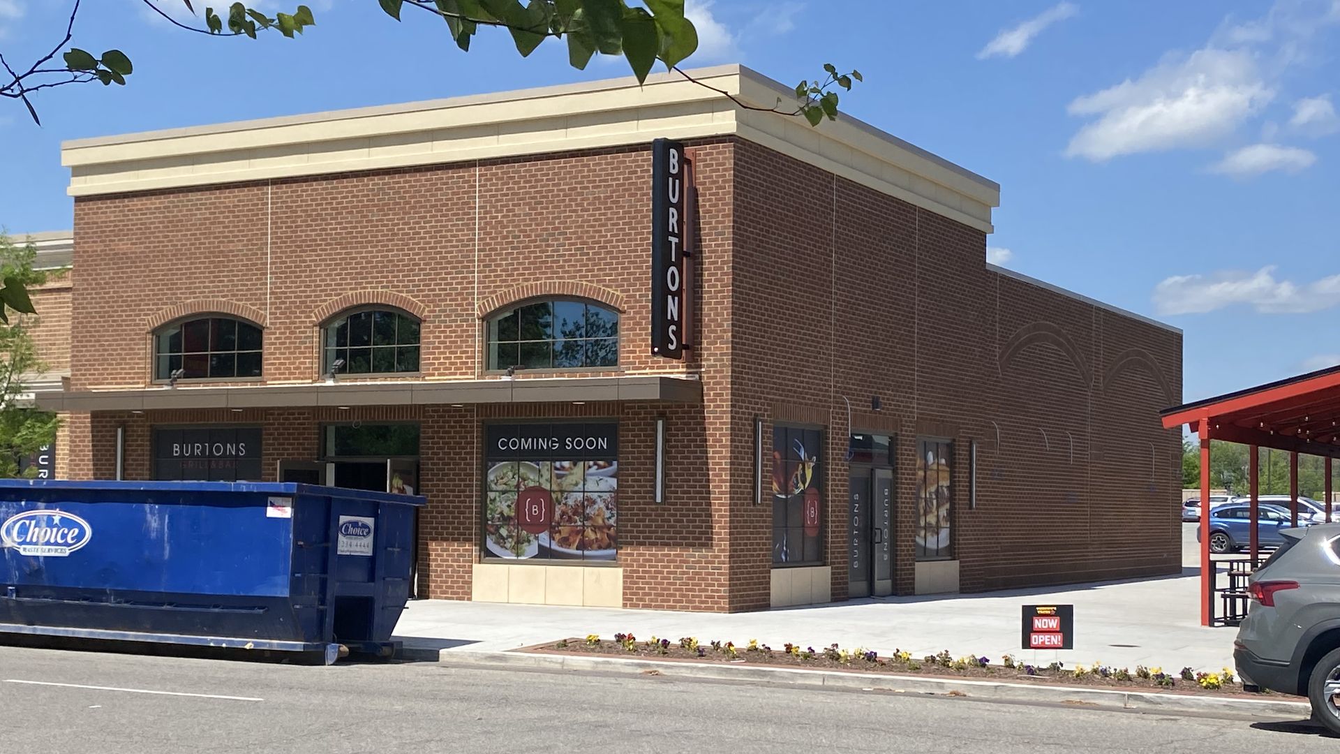 The outside of a restaurant under construction. it's brick