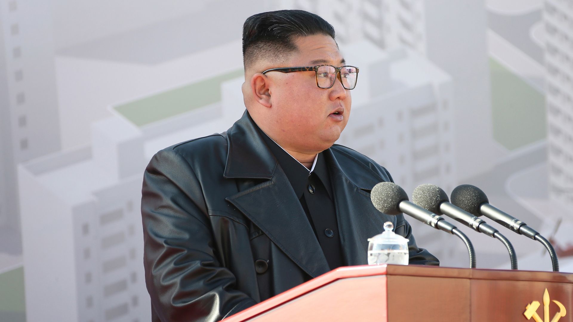 Picture of Kim Jong-un speaking behind a podium