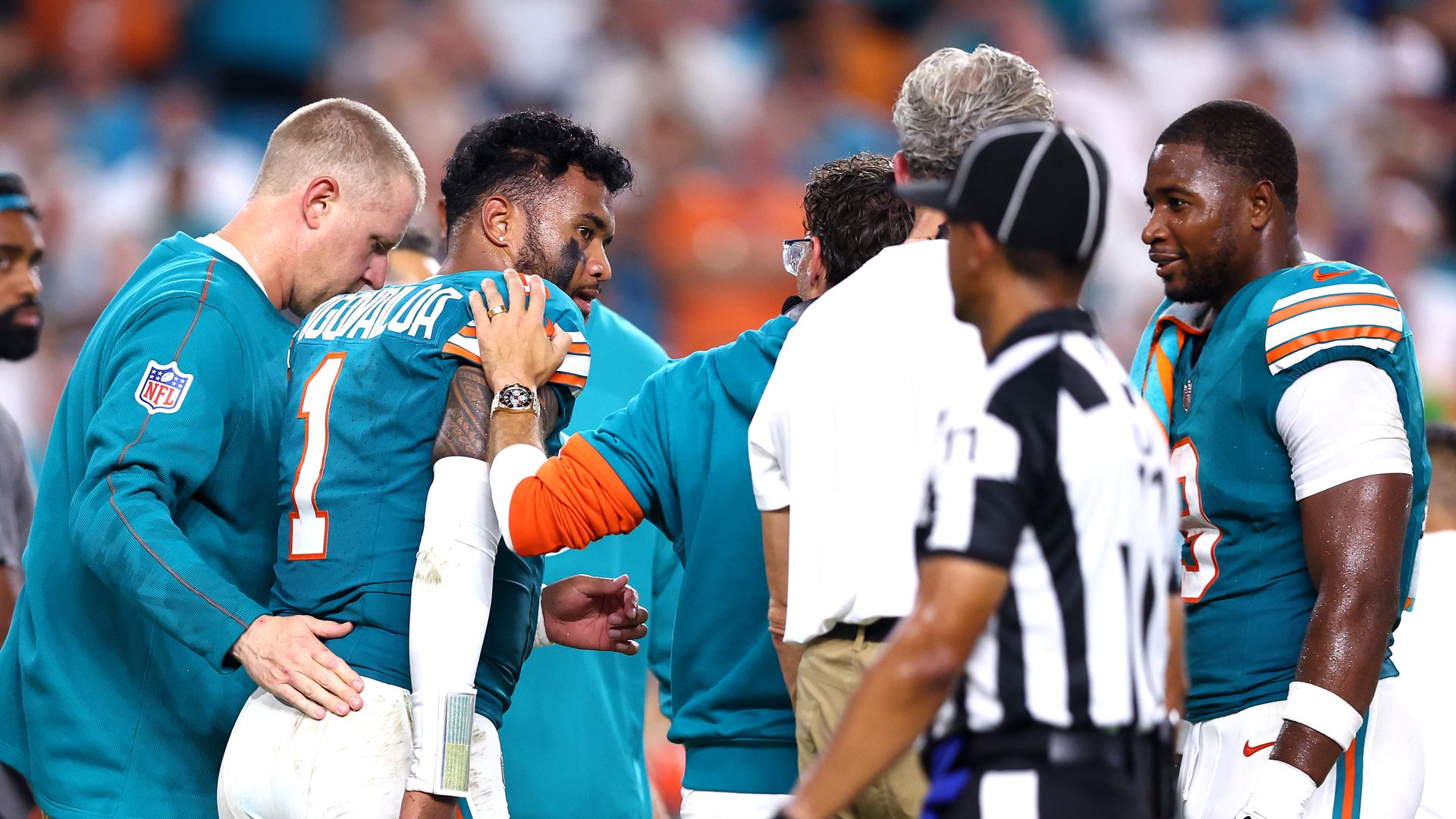 MIAMI GARDENS, FLORIDA - SEPTEMBER 12: Tua Tagovailoa #1 of the Miami Dolphins walks off the field after play on the field against the Buffalo Bills during the third quarter in the game at Hard Rock Stadium on September 12, 2024 in Miami Gardens, Florida. 