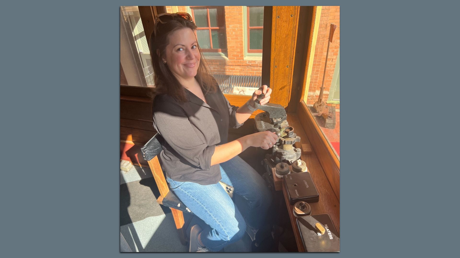 Tasha Tsiaperas sits in a historic rail car