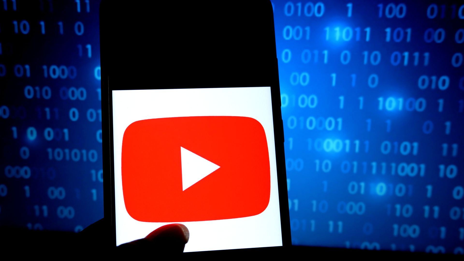 An illustration of YouTube logo on a smartphone against a background of ones and zeros.