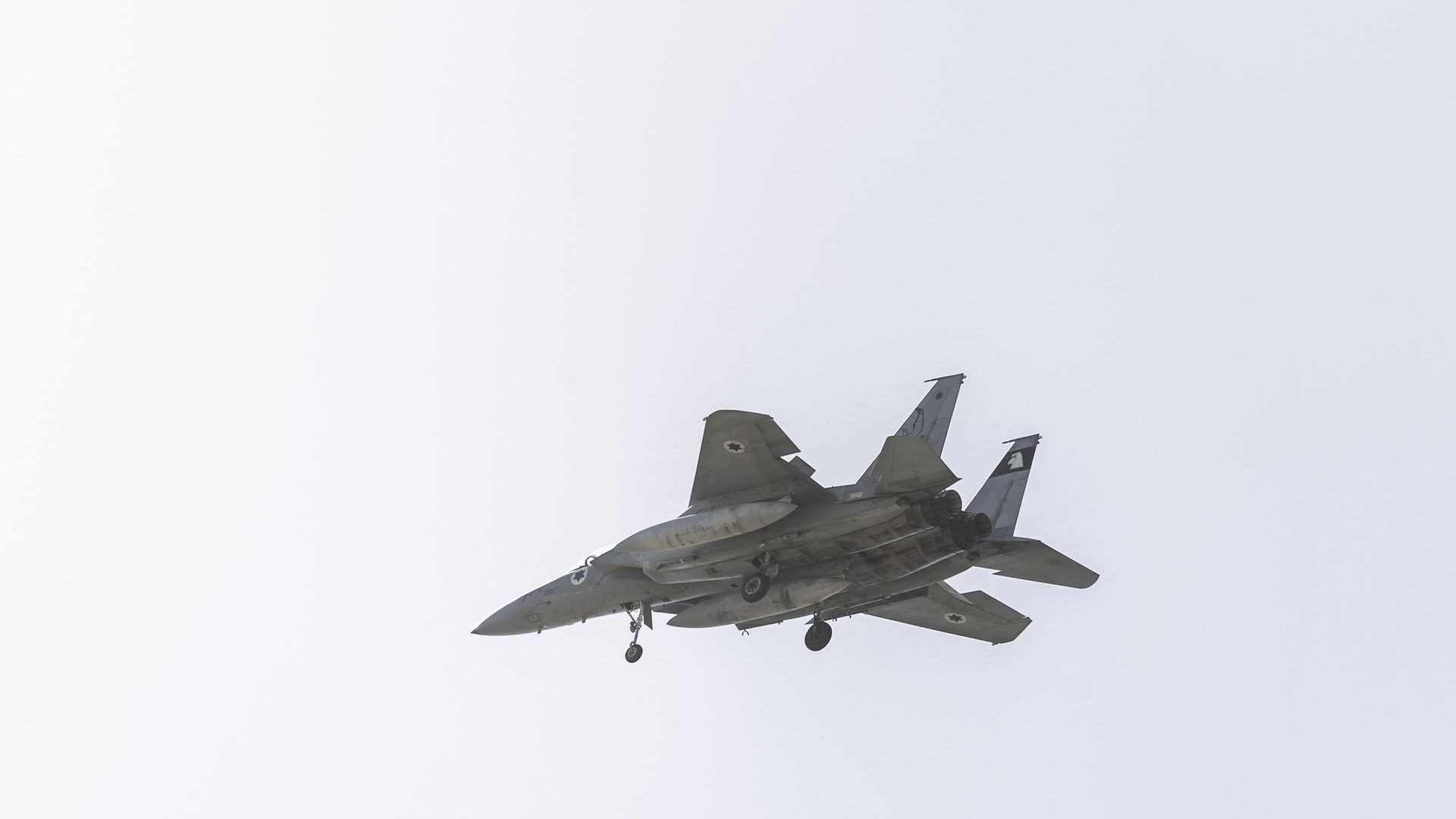 An Israeli Air Force F-15 fighter jet flies over the outskirts of Tel Aviv on March 20, 2026.