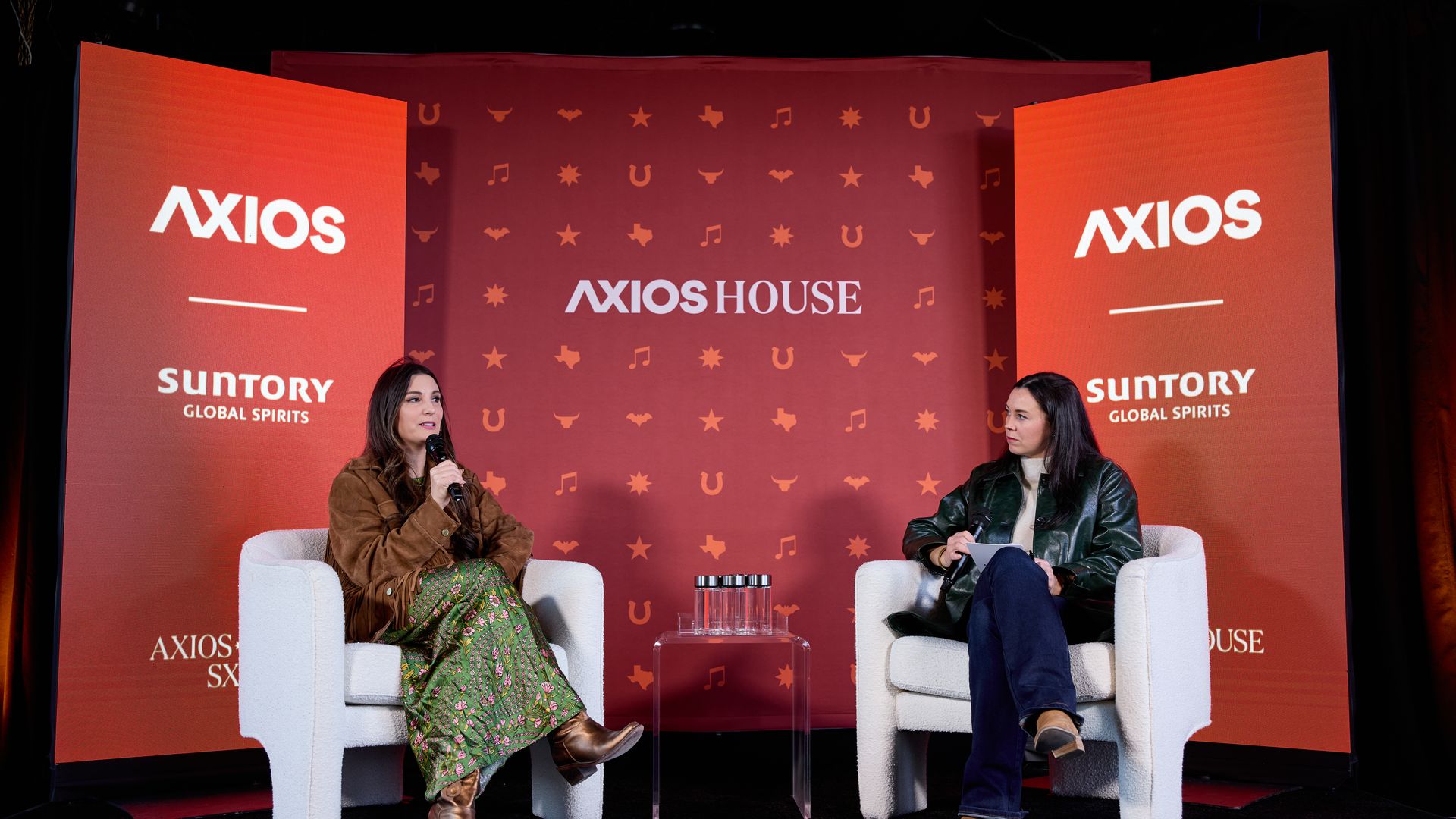 photo of Kim Chappell on stage at Axios House