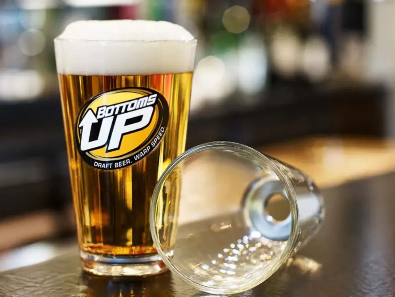 The hole in the bottom of a Bottoms Up glass gets plugged by a removable magnet. 