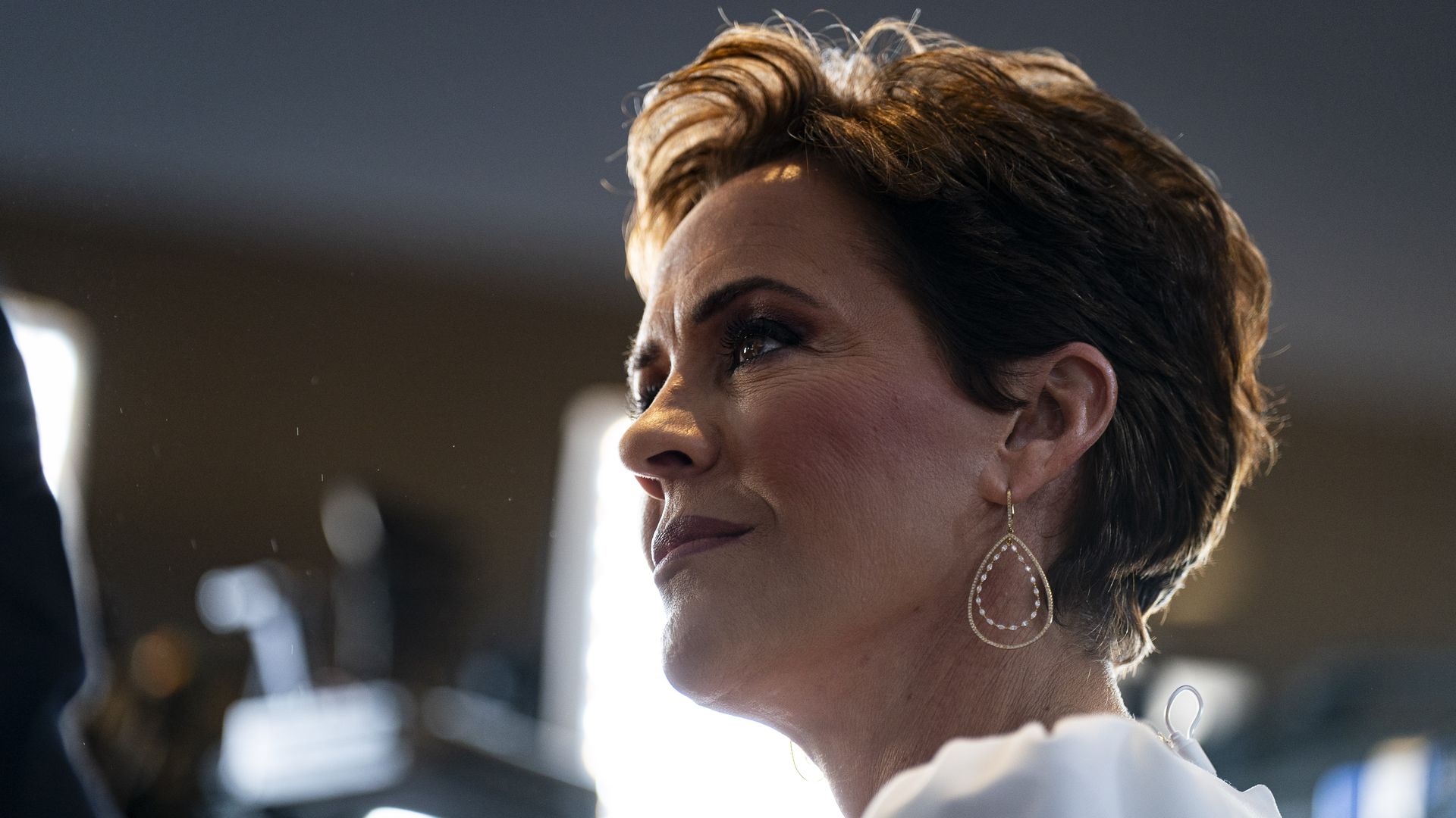 Kari Lake, US Republican Senate candidate for Arizona, during a television interview at a New Hampshire primary election night watch party with former US President Donald Trump