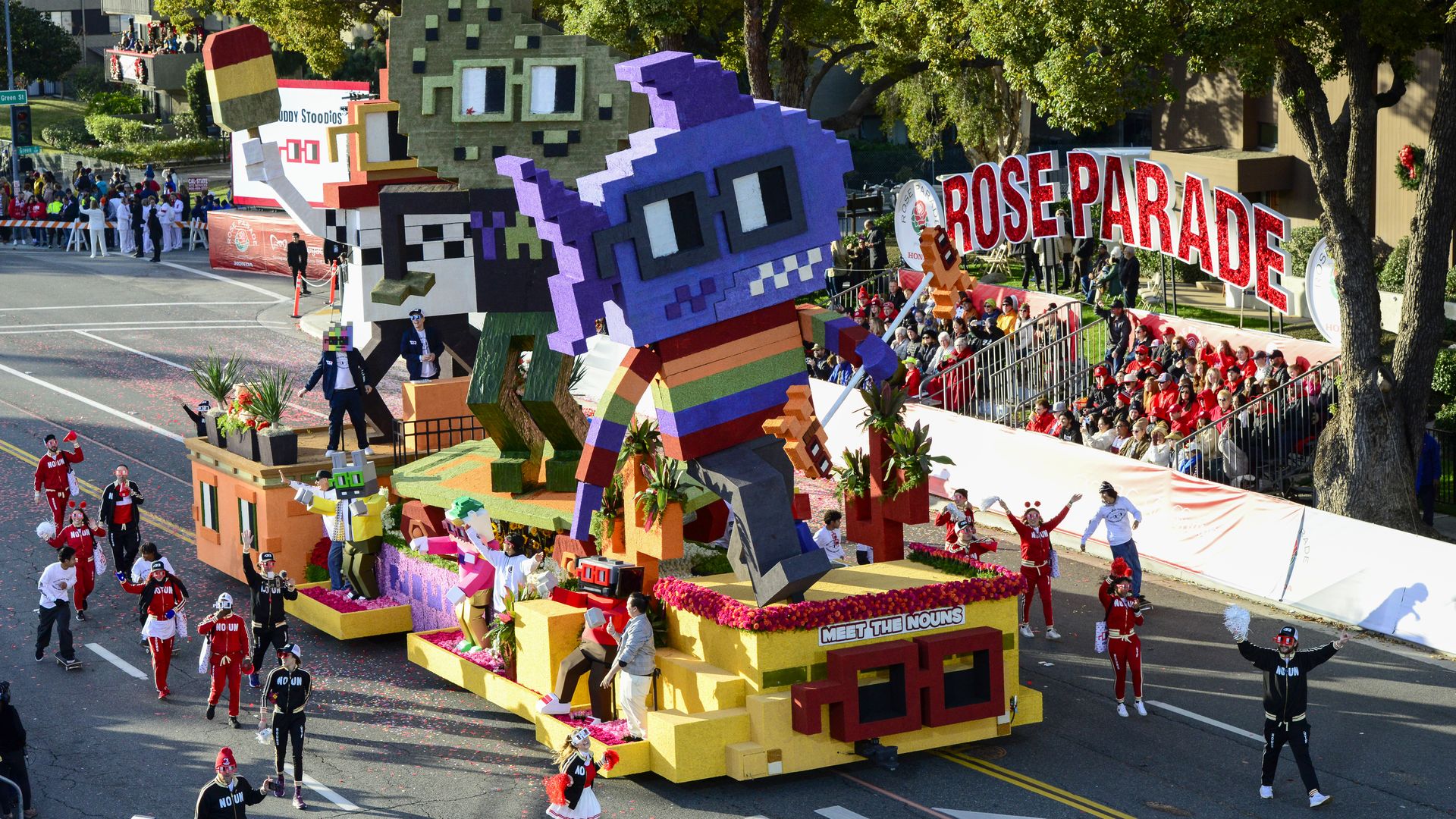 A parade float celebrating the Nouns NFT project, in its lo-fi style.